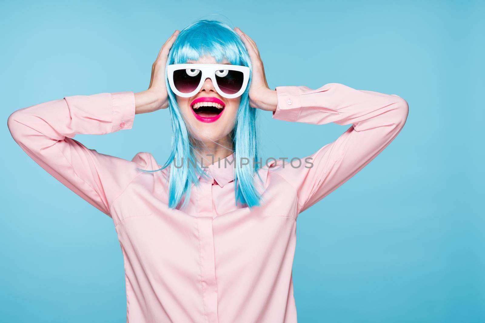 beautiful woman in blue wig sunglasses Glamor fashion. High quality photo