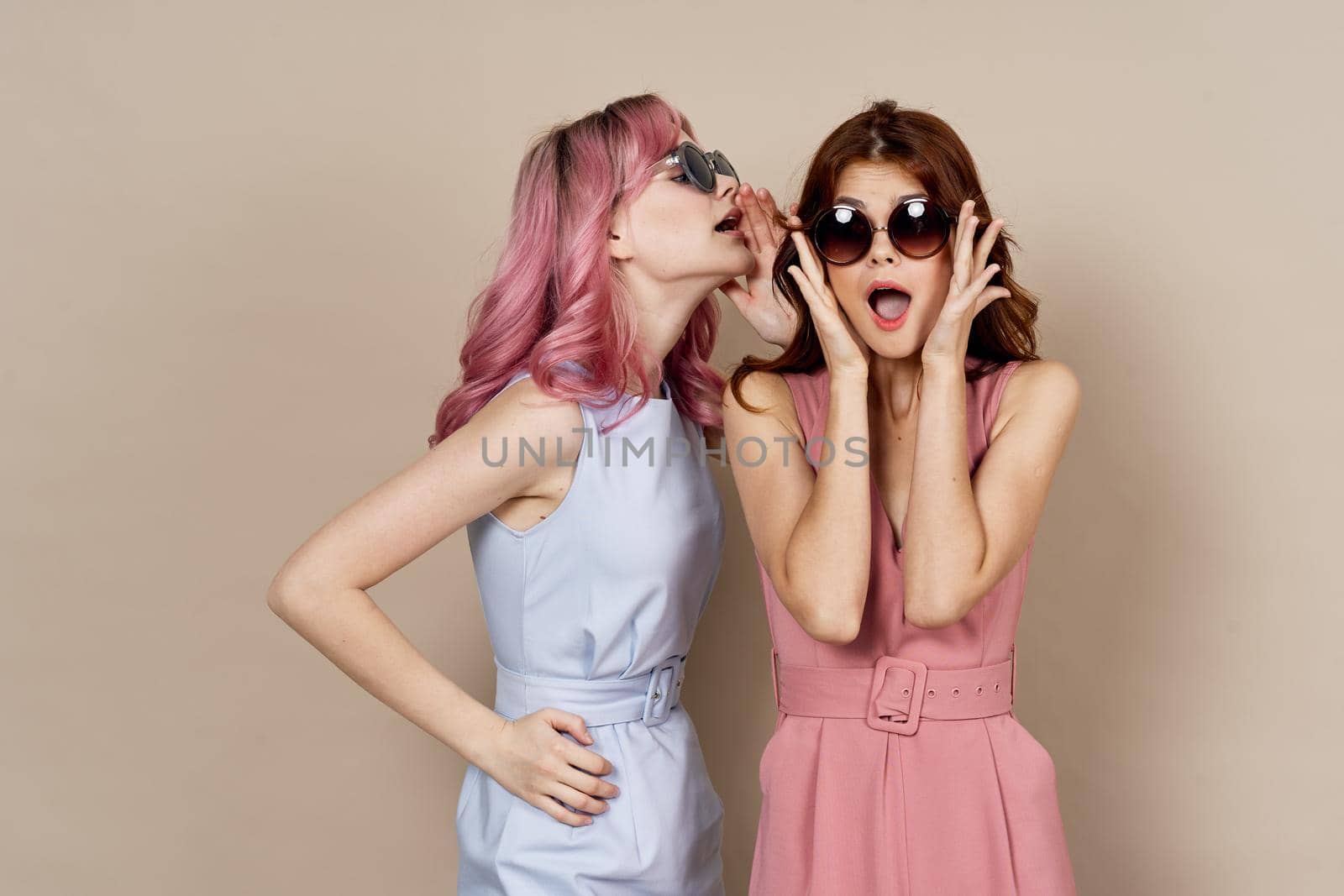 two women in fashionable clothes posing model decoration. High quality photo