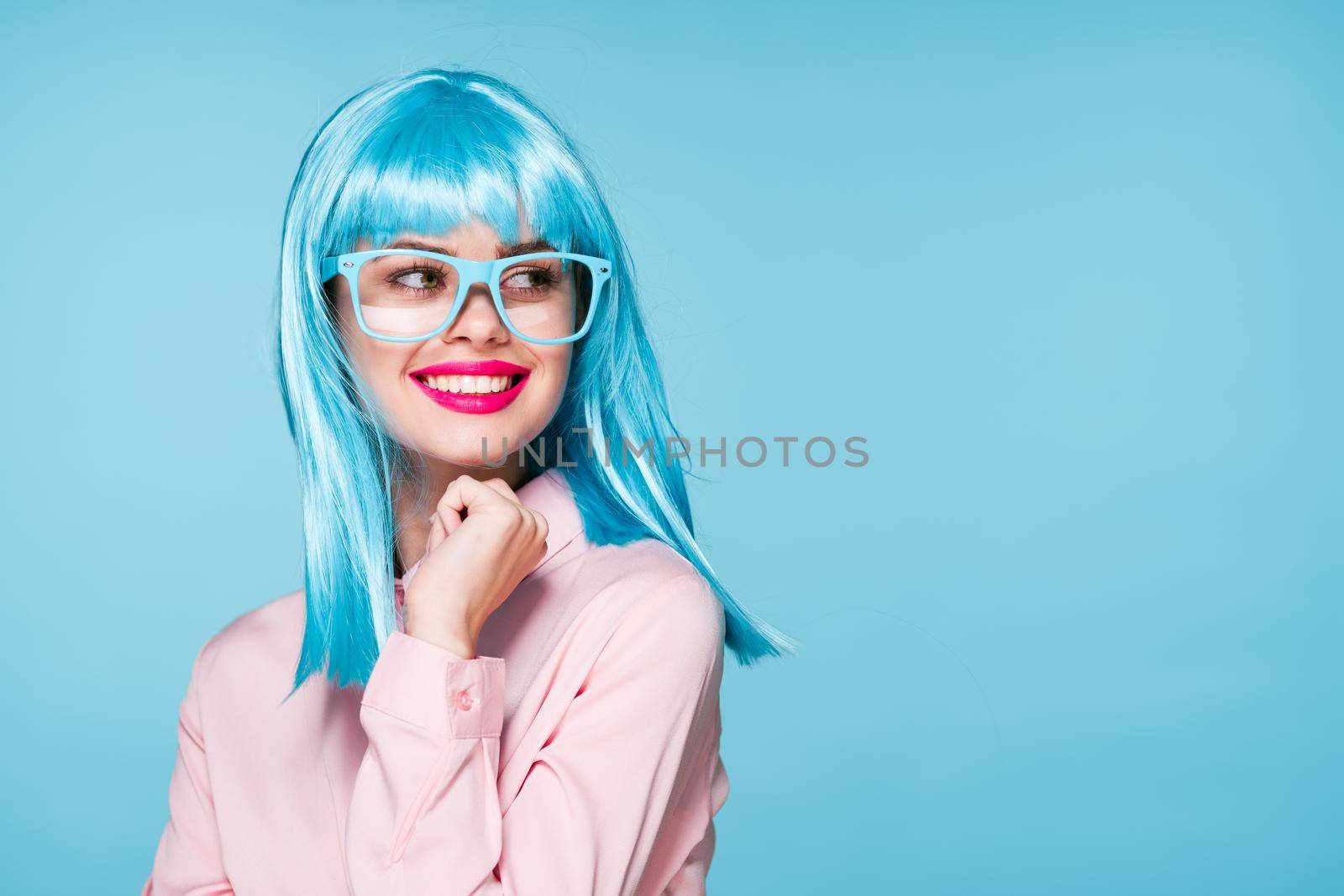 pretty woman in pink shirt purple wig glasses red lips. High quality photo