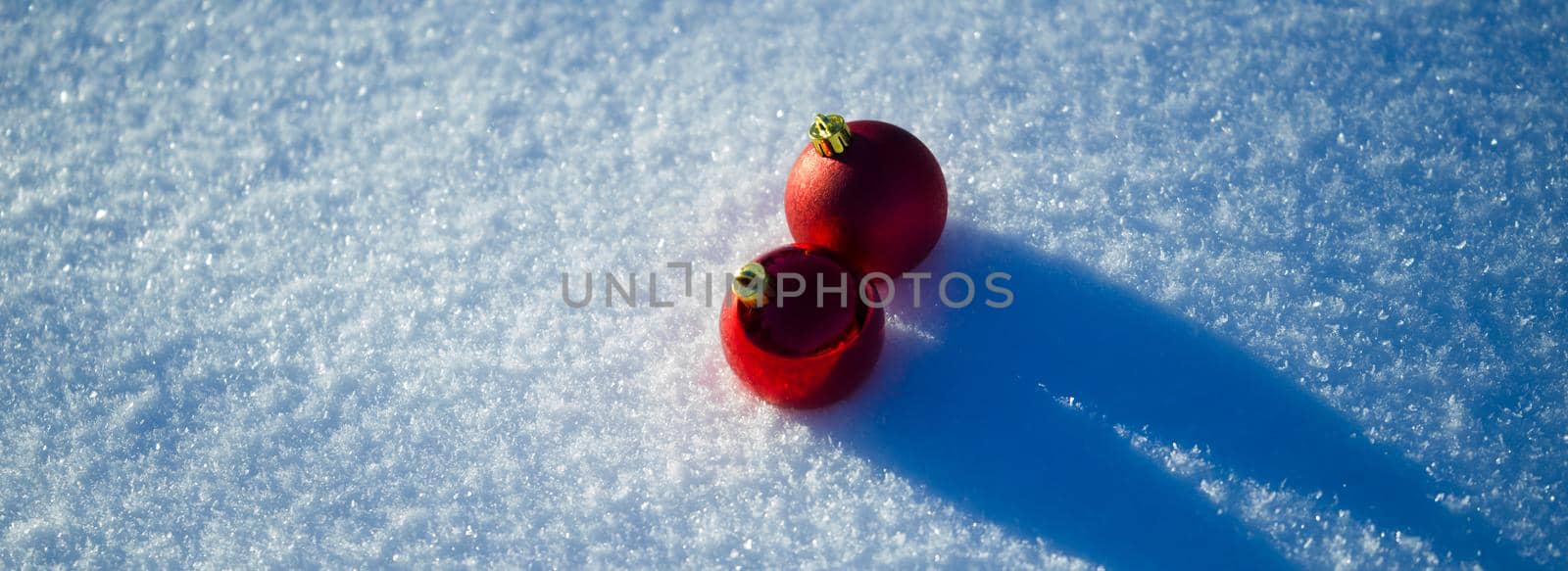 christmas balls tree decoration in fresh snow abstract background