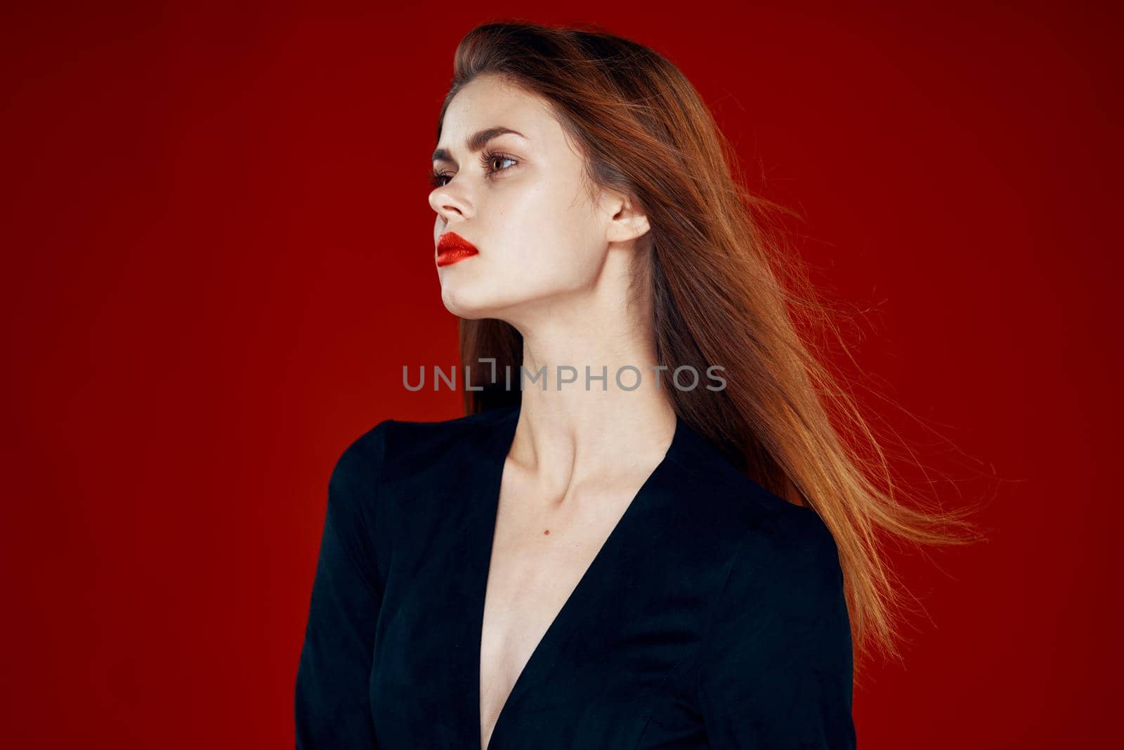 red-haired woman with red lips posing hairstyle glamor. High quality photo