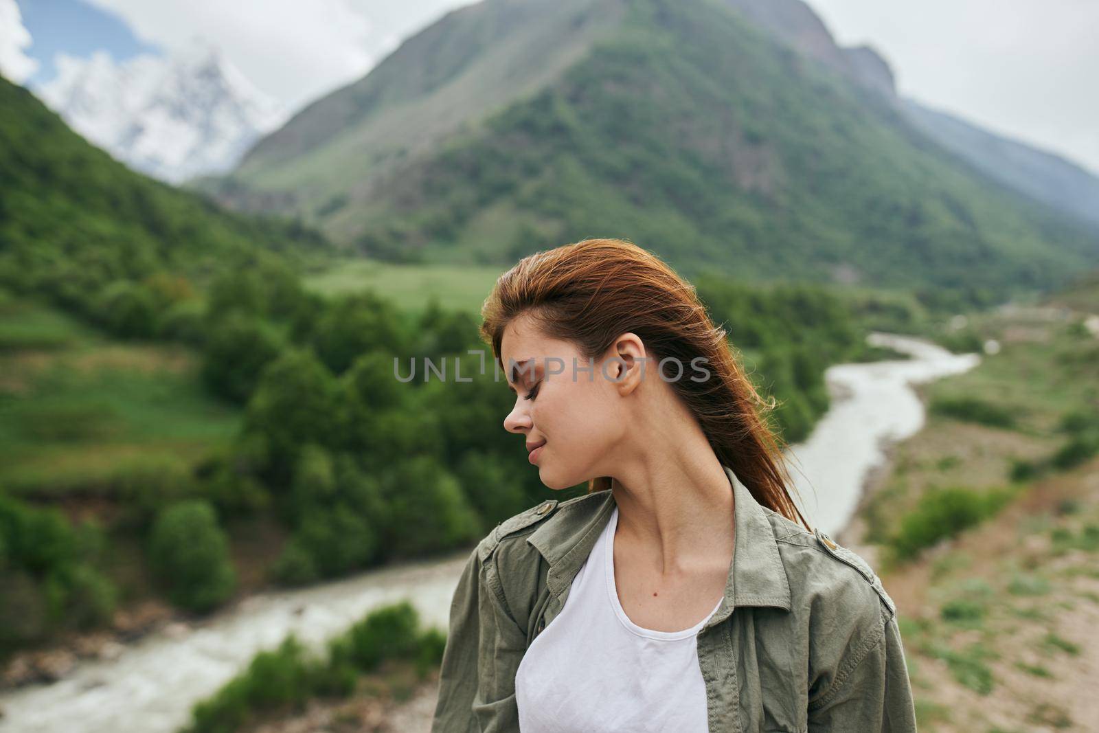 woman hiker mountains landscape travel freedom fresh air. High quality photo