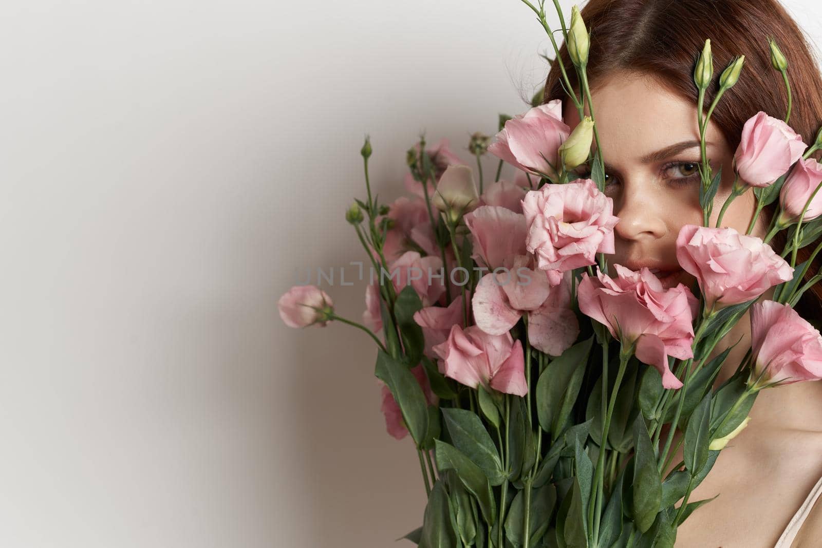 cheerful woman flowers in hands posing charm isolated background. High quality photo