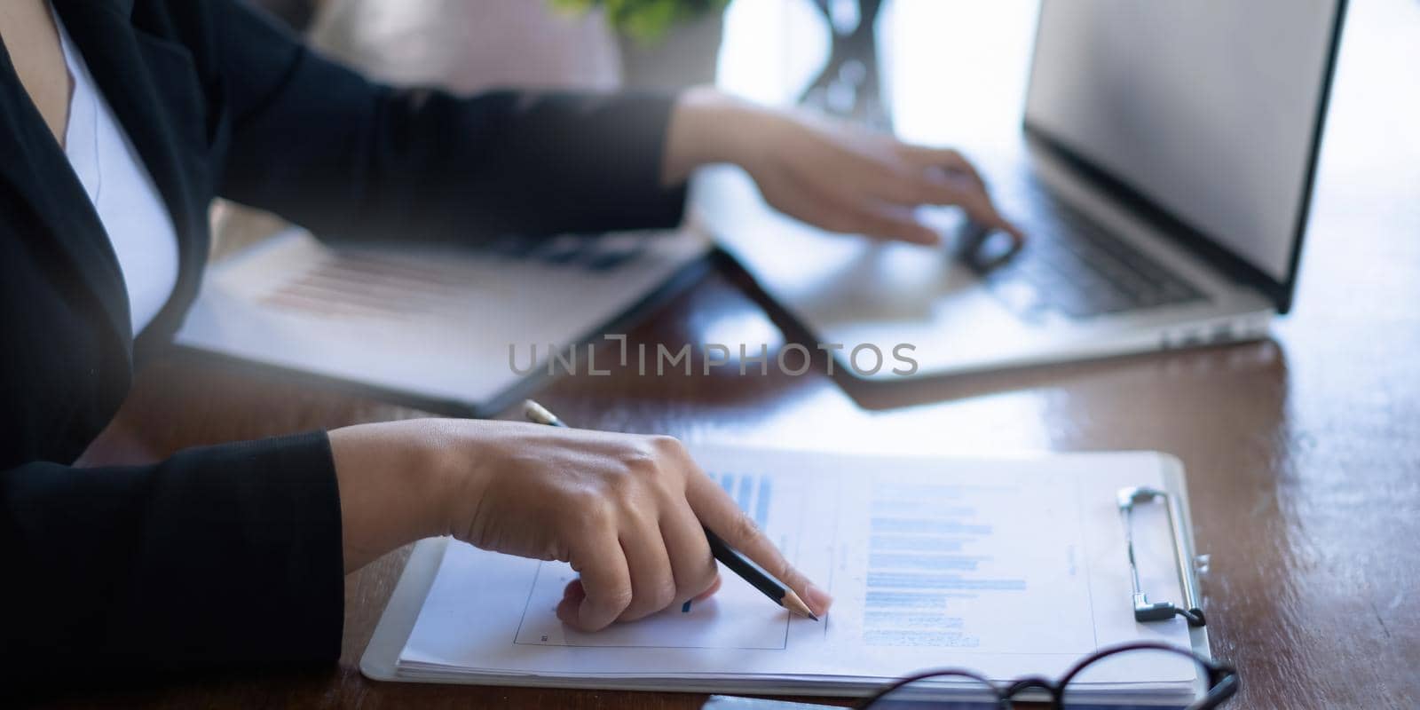 Business woman working to analyze technical price graph and indicator. account or saving money or insurance concept