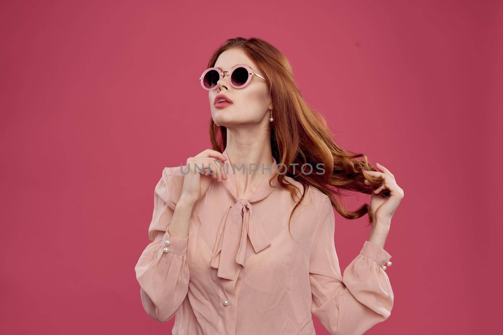 pretty woman posing cosmetics charm pink background. High quality photo