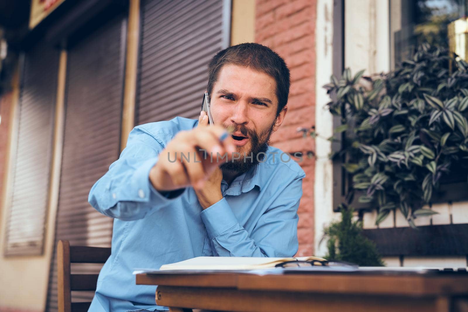 business man working on the street with laptop technology. High quality photo