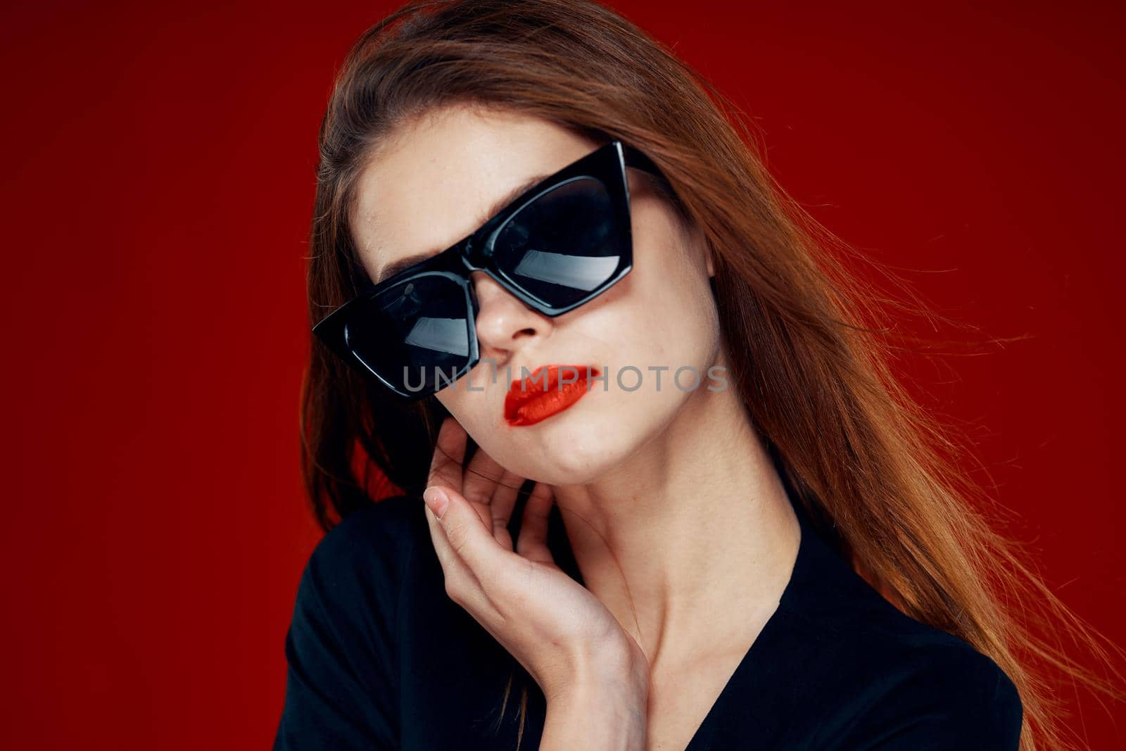 glamorous woman wearing sunglasses red lips posing close-up. High quality photo
