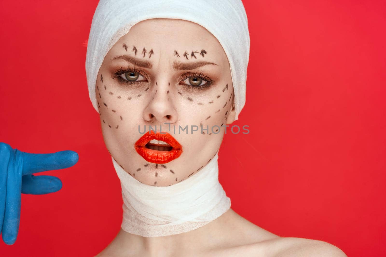 a person posing in blue gloves red lips surgery facial rejuvenation studio lifestyle by Vichizh