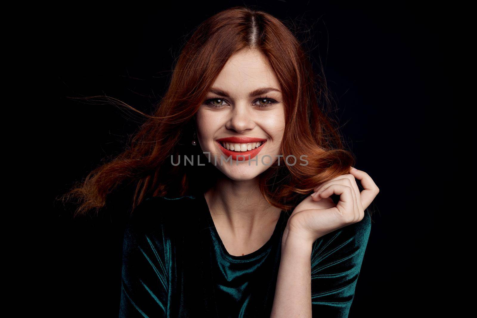 pretty woman decoration cosmetics posing Black background. High quality photo