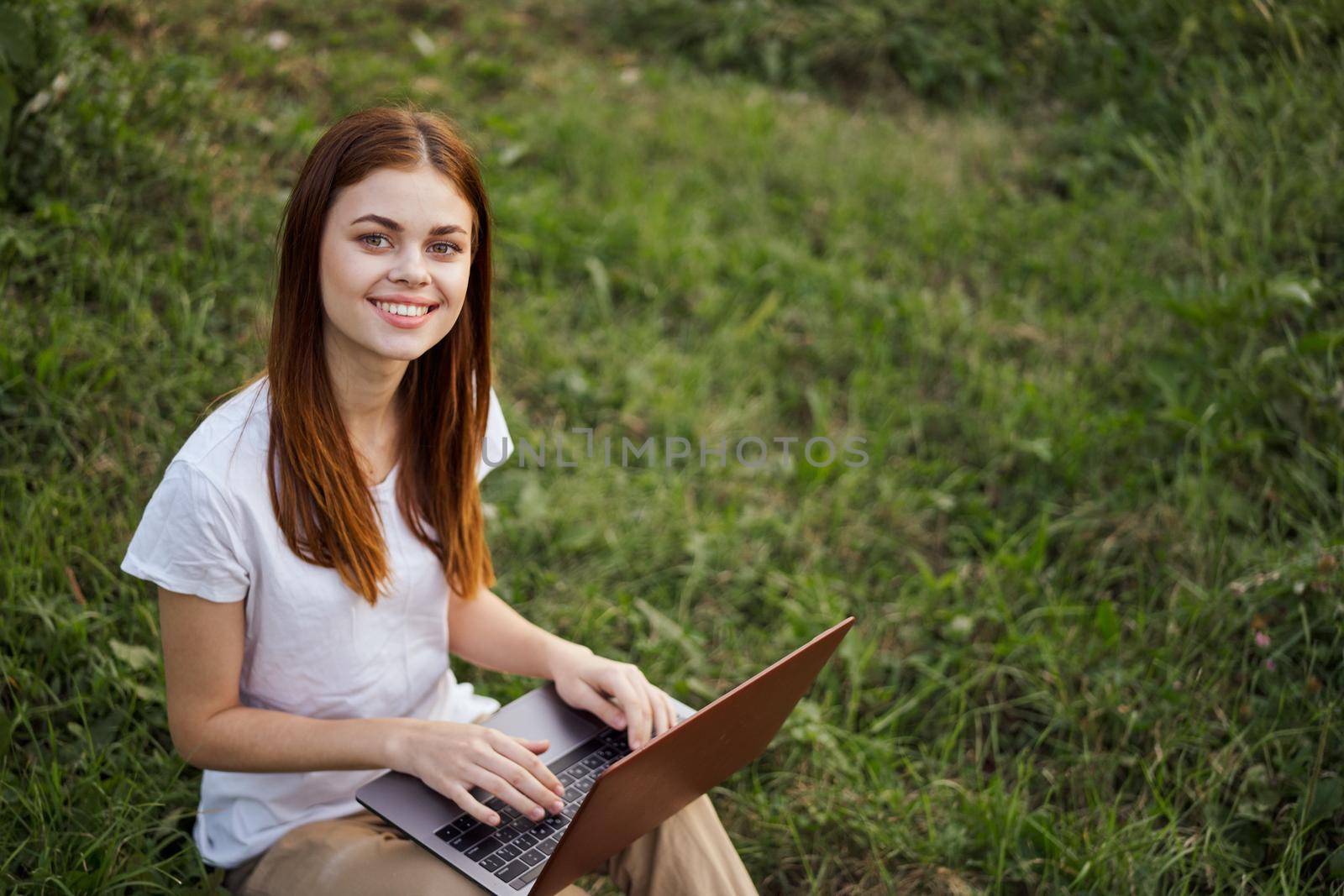 cheerful woman outdoors laptops communication internet recreation by Vichizh