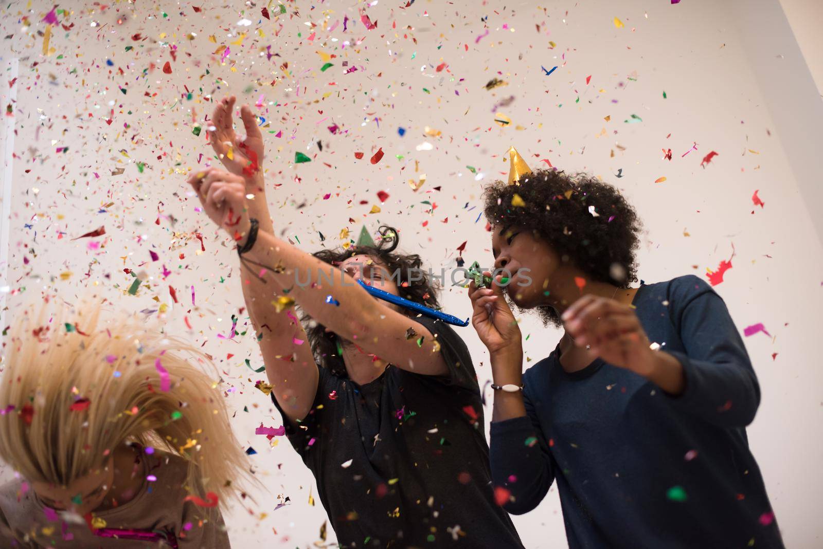 confetti party happy young people group celebrating new year eve while dancing and have fun at home