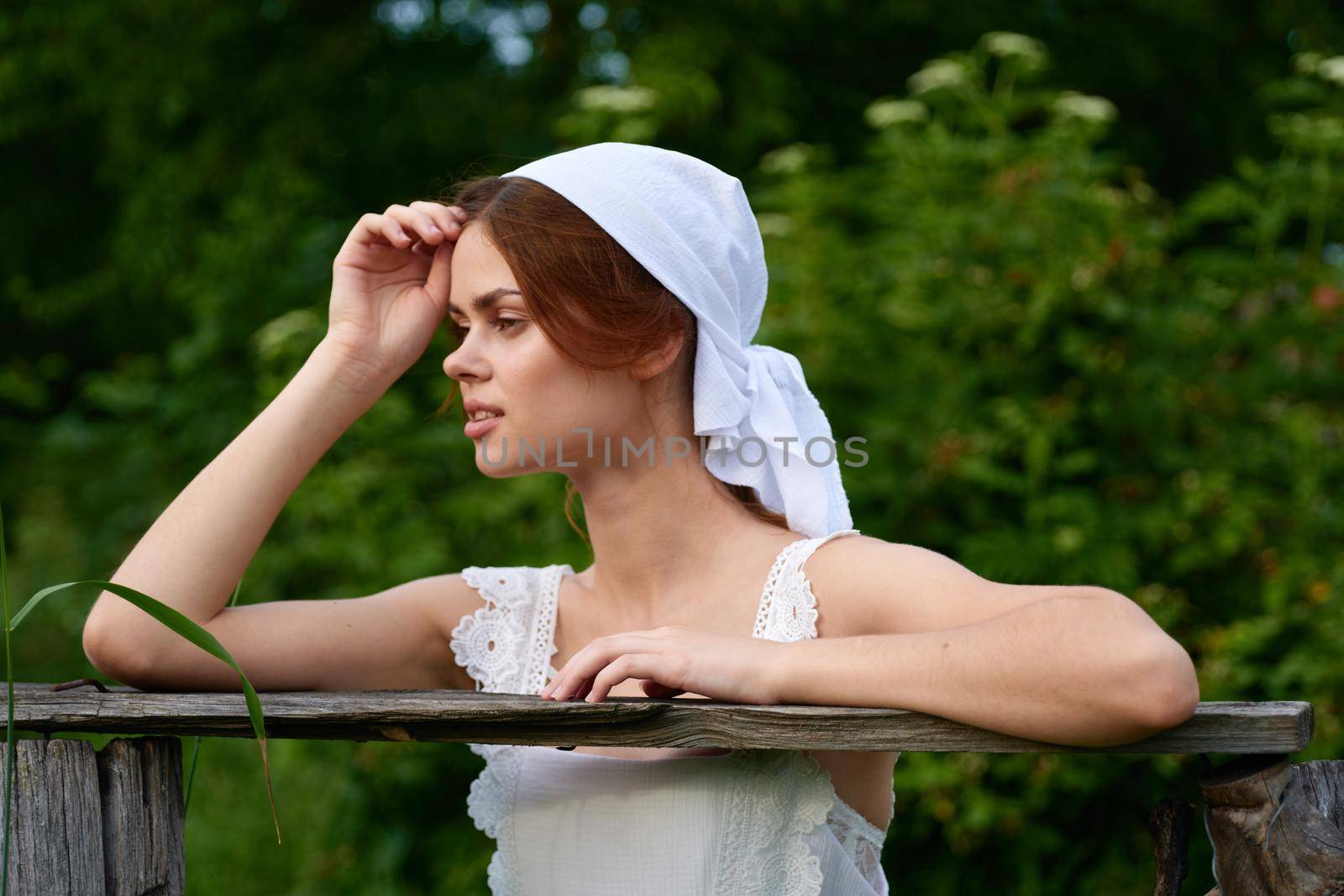 cheerful woman outdoors in the garden countryside ecology nature. High quality photo