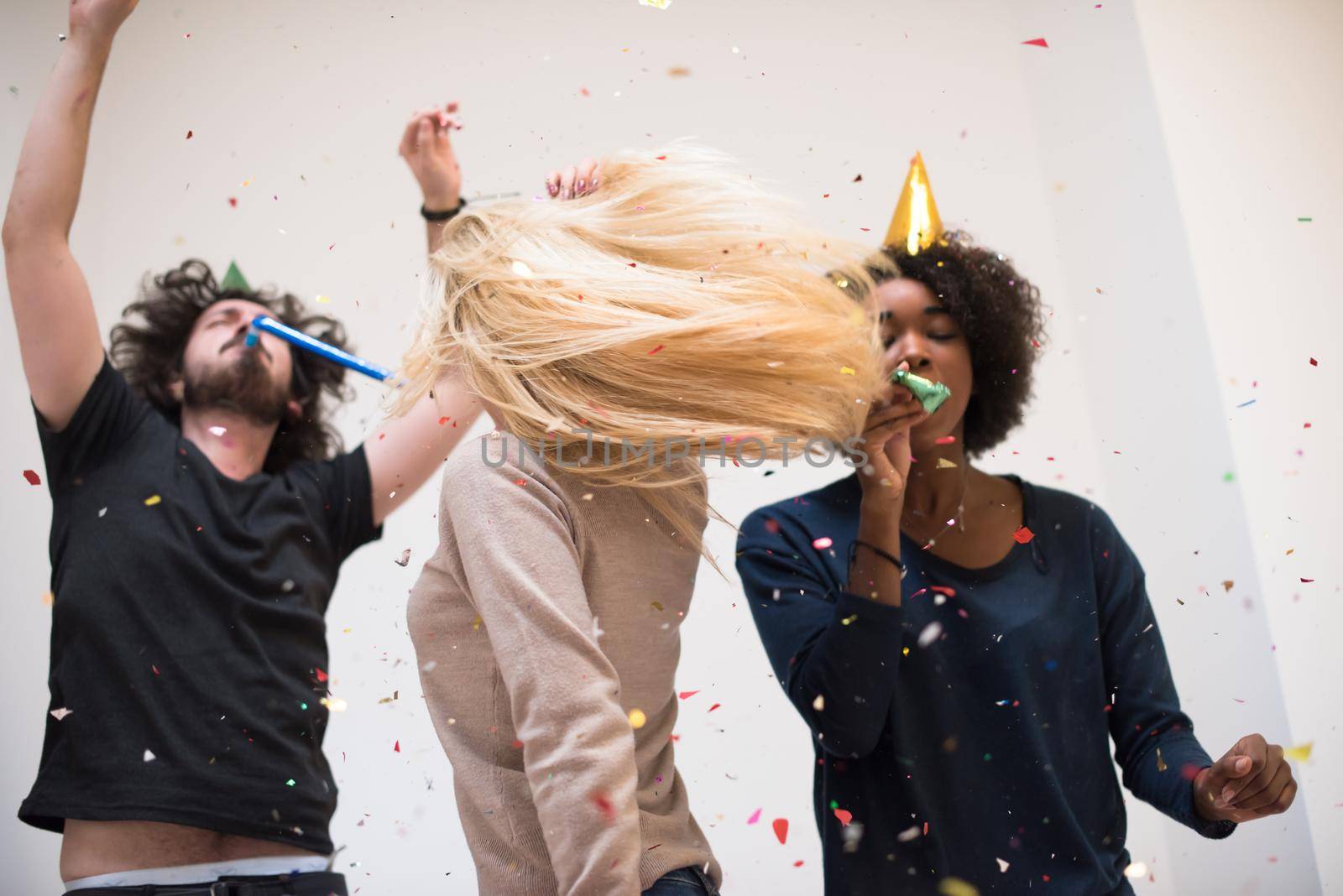 confetti party happy young people group celebrating new year eve while dancing and have fun at home