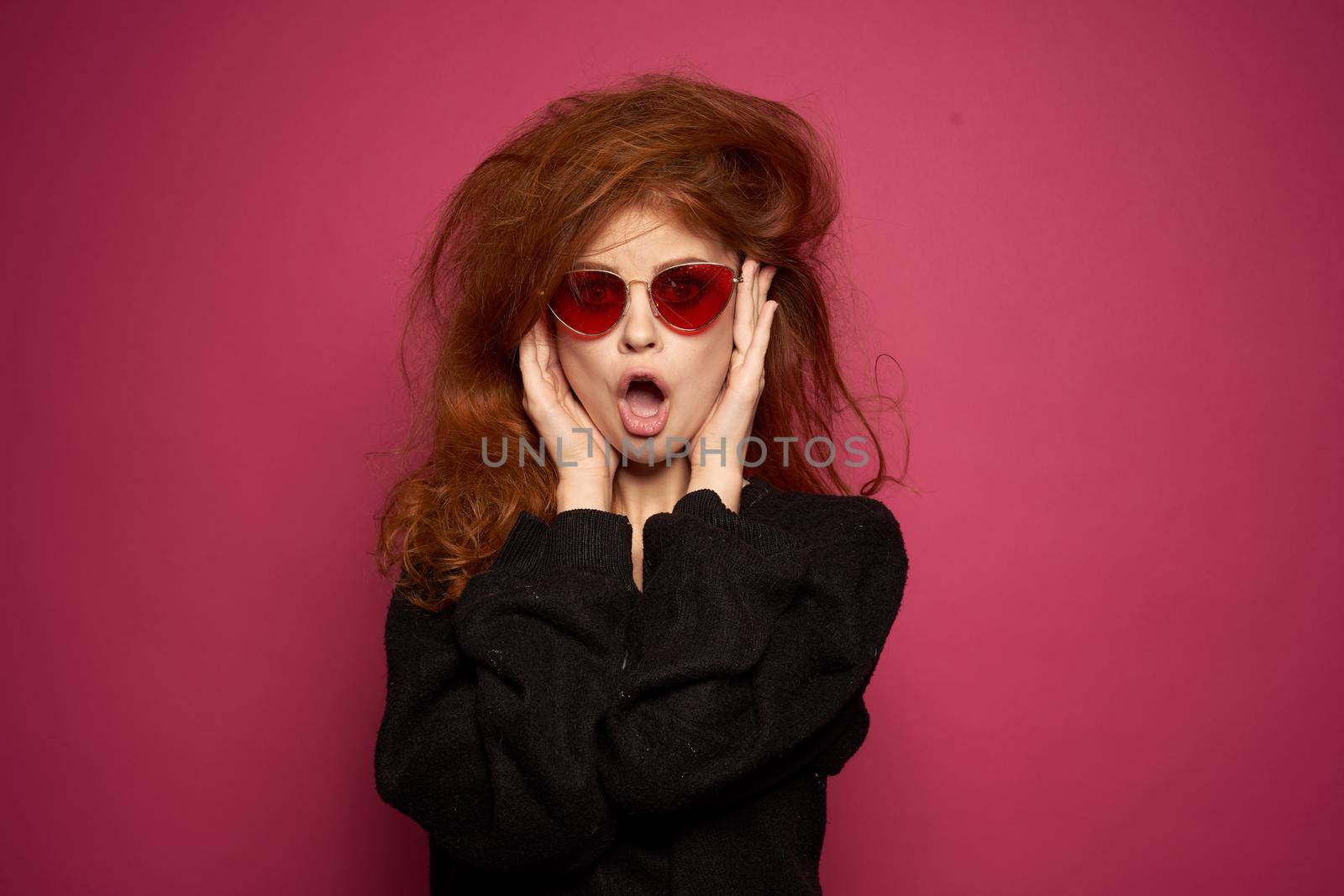 pretty woman fashionable hairstyle sunglasses posing Studio Model. High quality photo