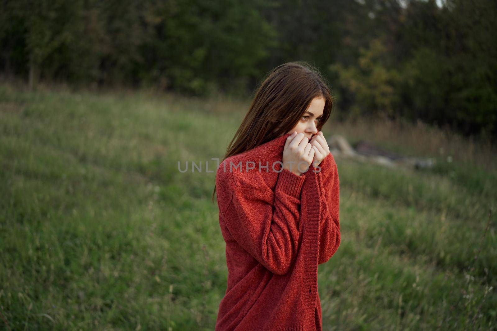 woman outdoors in a red sweater cool nature by Vichizh