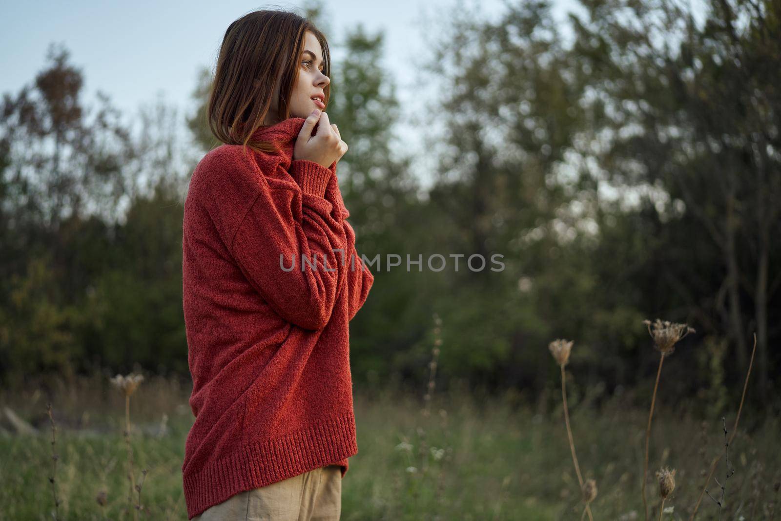 woman outdoors in a red sweater cool nature by Vichizh