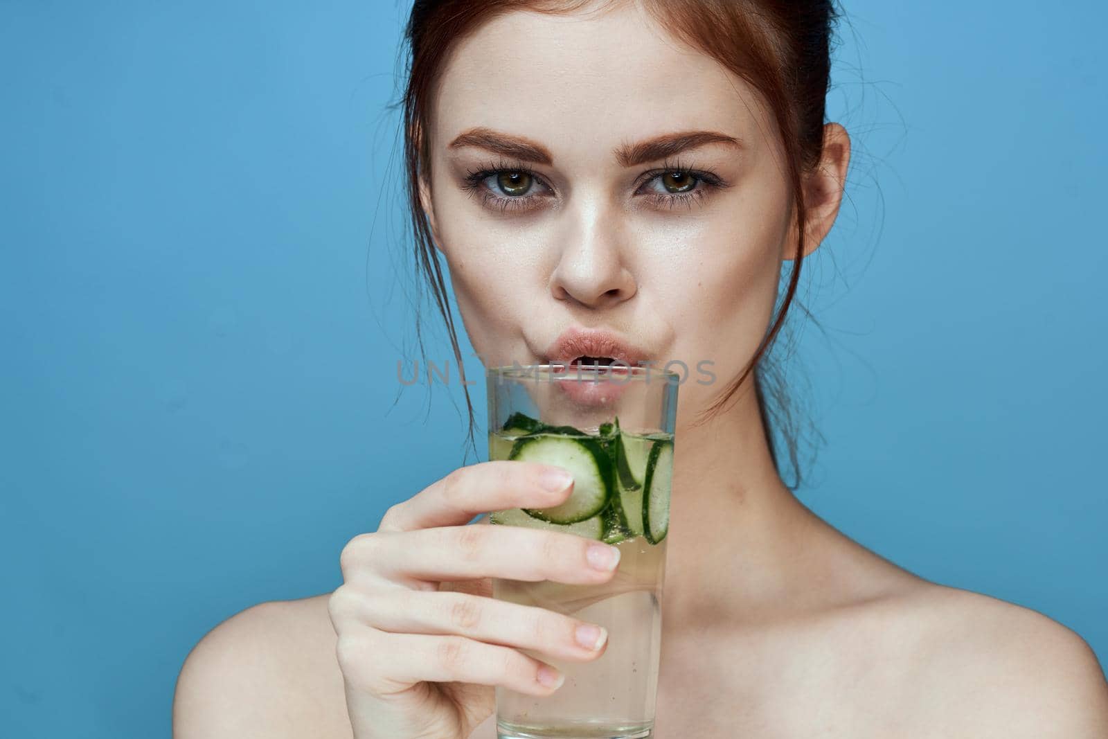 pretty woman with cucumber drink health vitamins by Vichizh