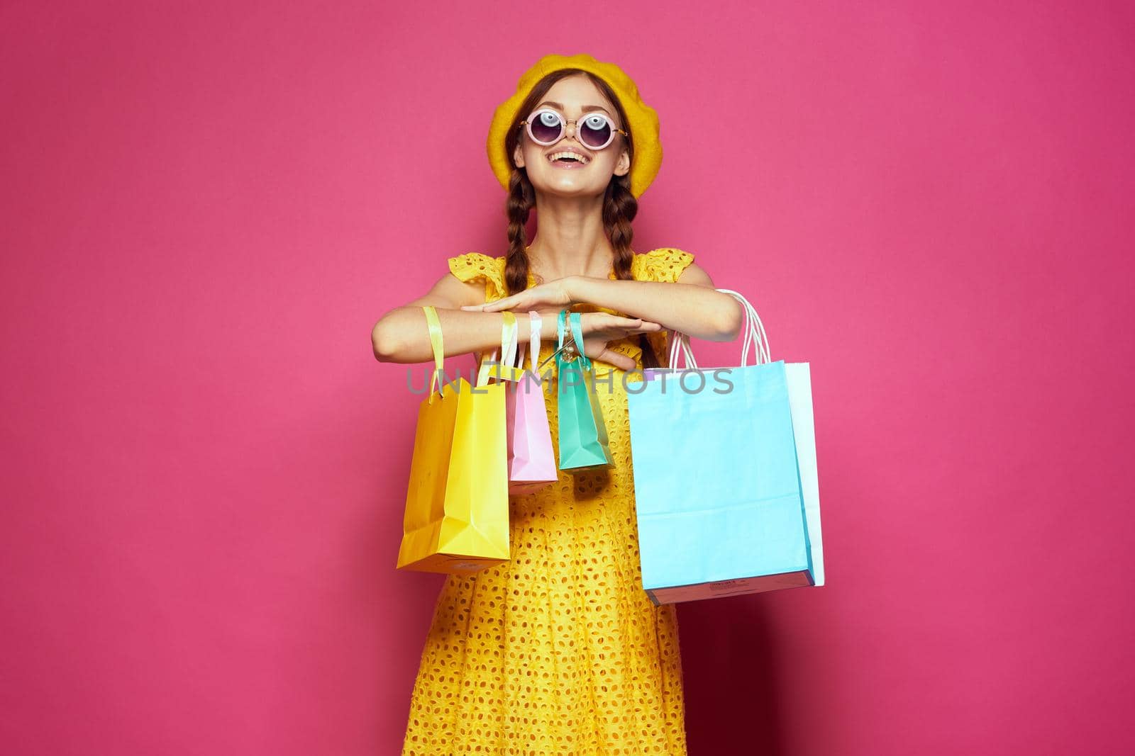 glamorous woman wearing sunglasses posing shopping fashion isolated background. High quality photo
