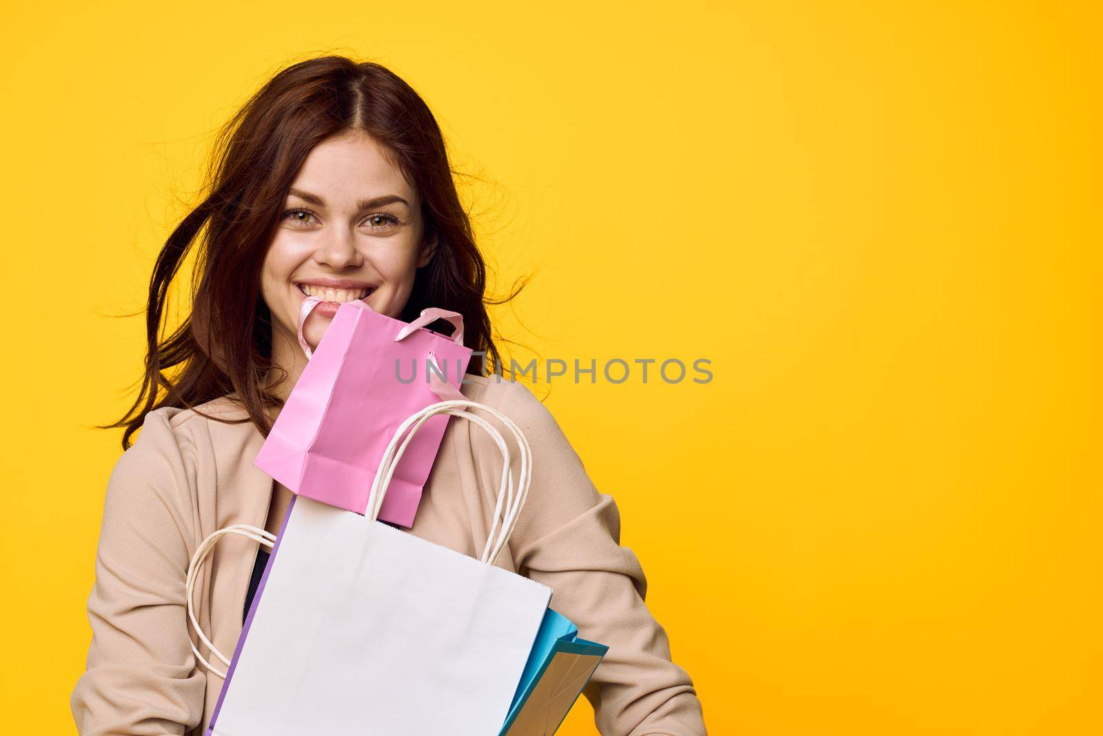 glamorous woman shopping entertainment lifestyle yellow background by Vichizh