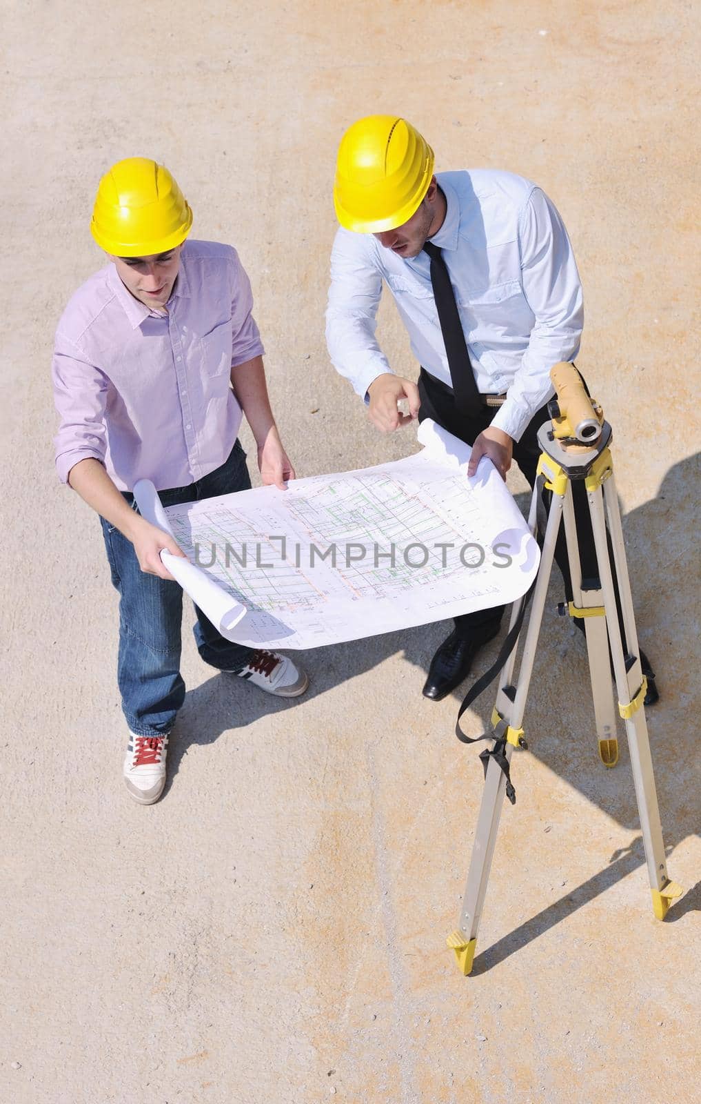 Team of business people in group, architect and engeneer  on construciton site check documents and business workflow on new building