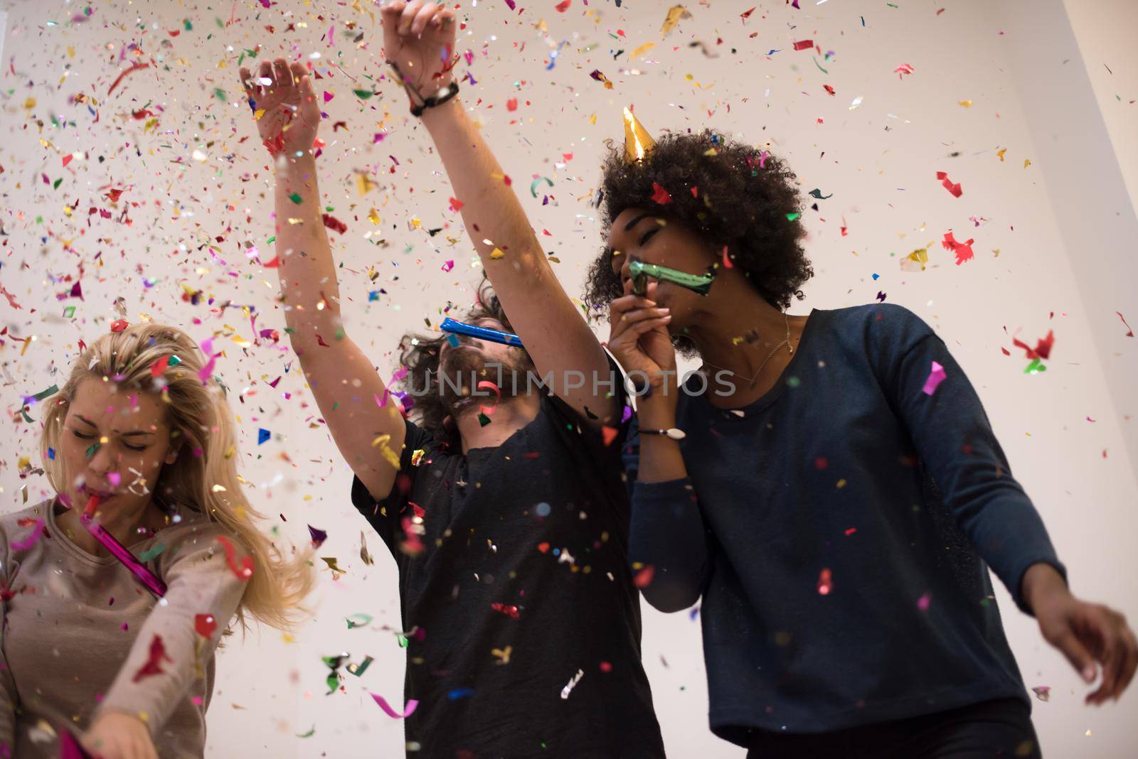 confetti party happy young people group celebrating new year eve while dancing and have fun at home