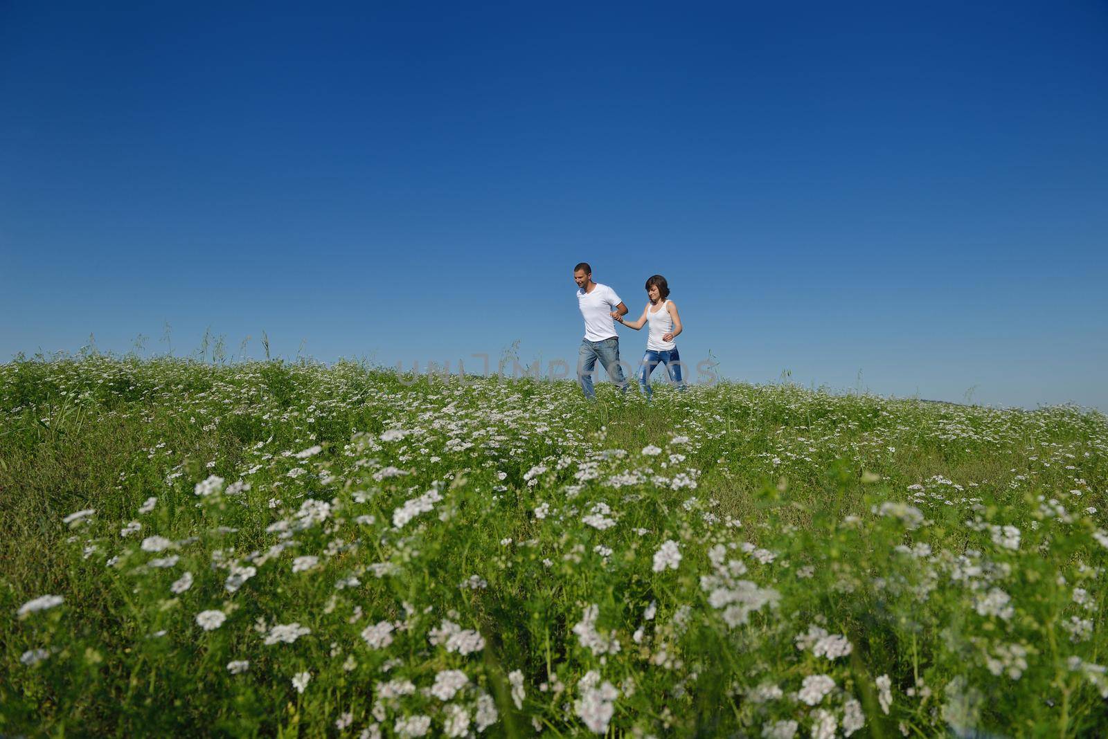 happy young couple in love have romance and fun at wheat field in summer