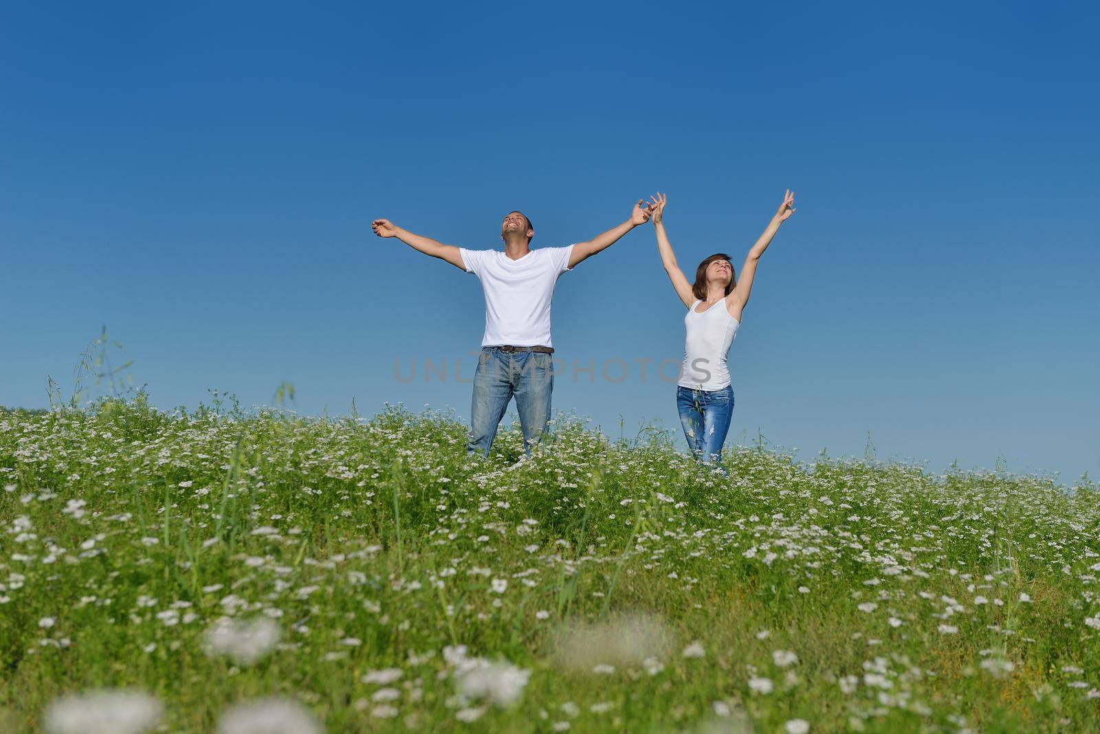 happy young couple in love have romance and fun at wheat field in summer