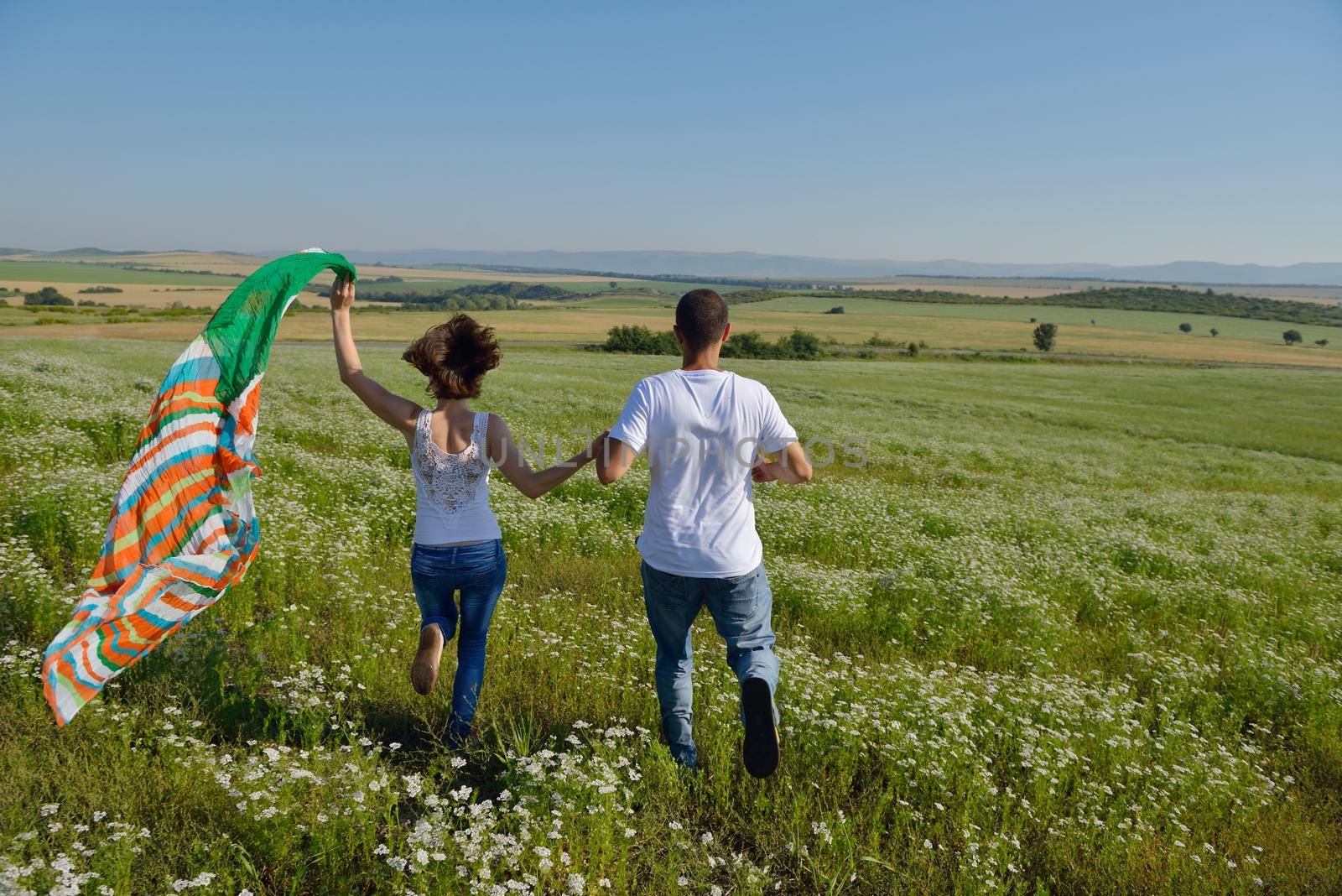 happy young couple in love have romance and fun at wheat field in summer