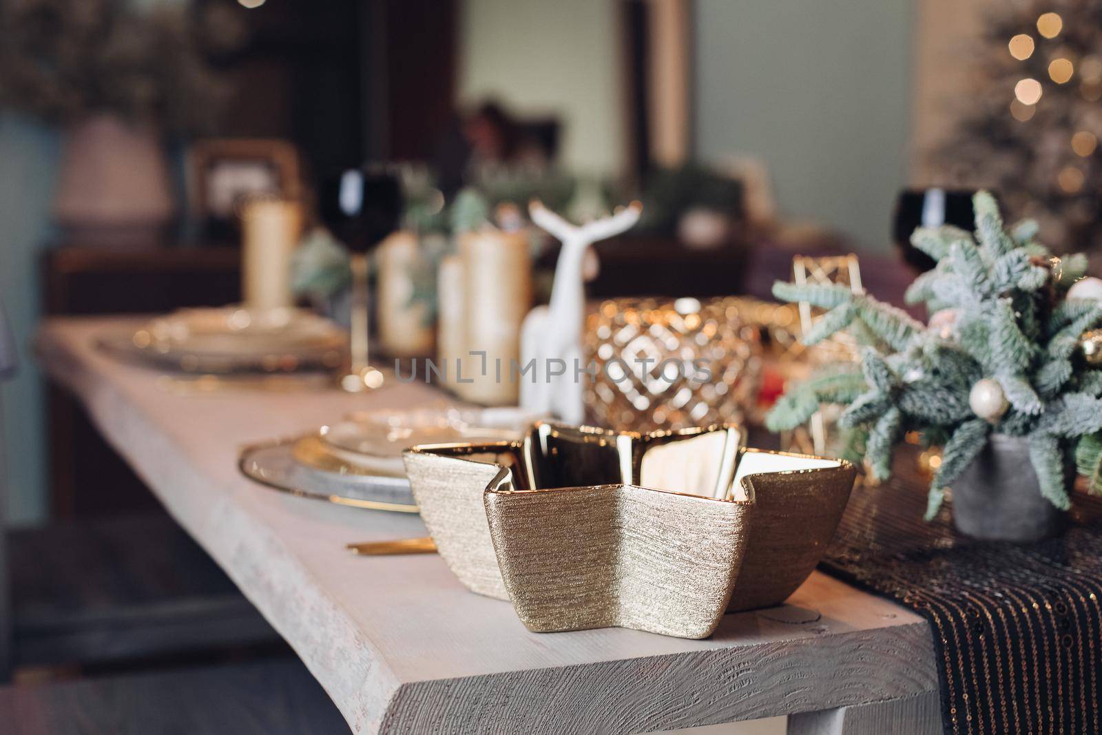 Table served for Christmas dinner in living room. New Year eve concept