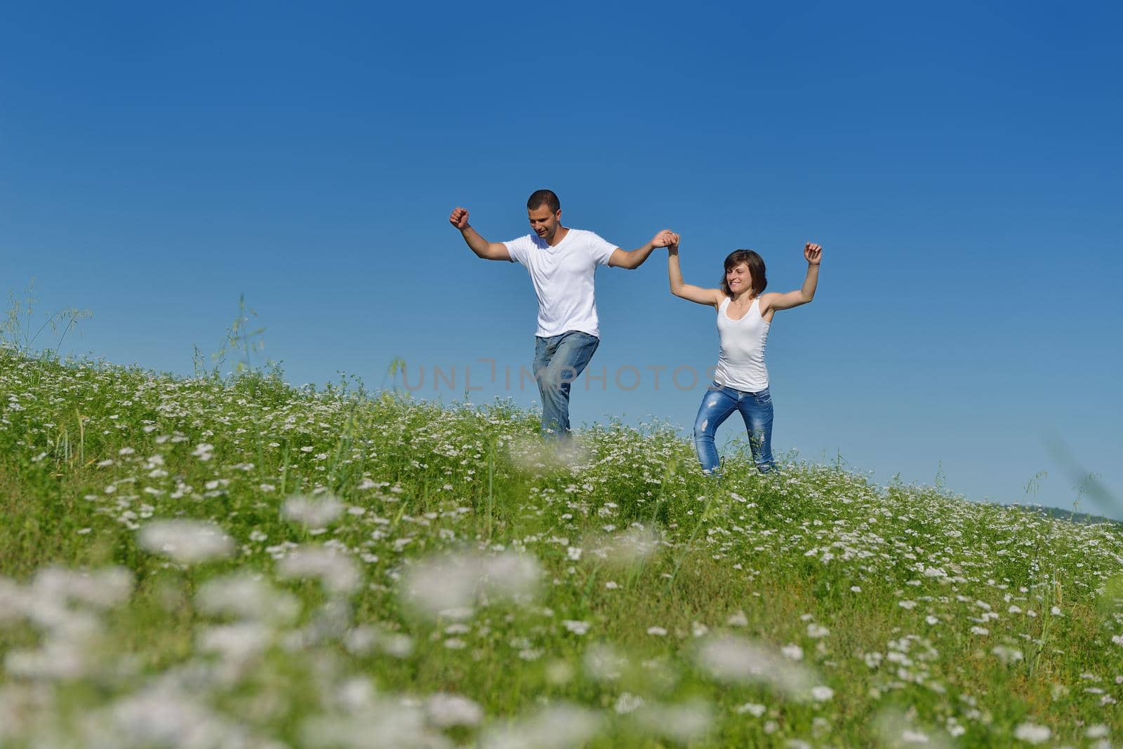 happy young couple in love have romance and fun at wheat field in summer