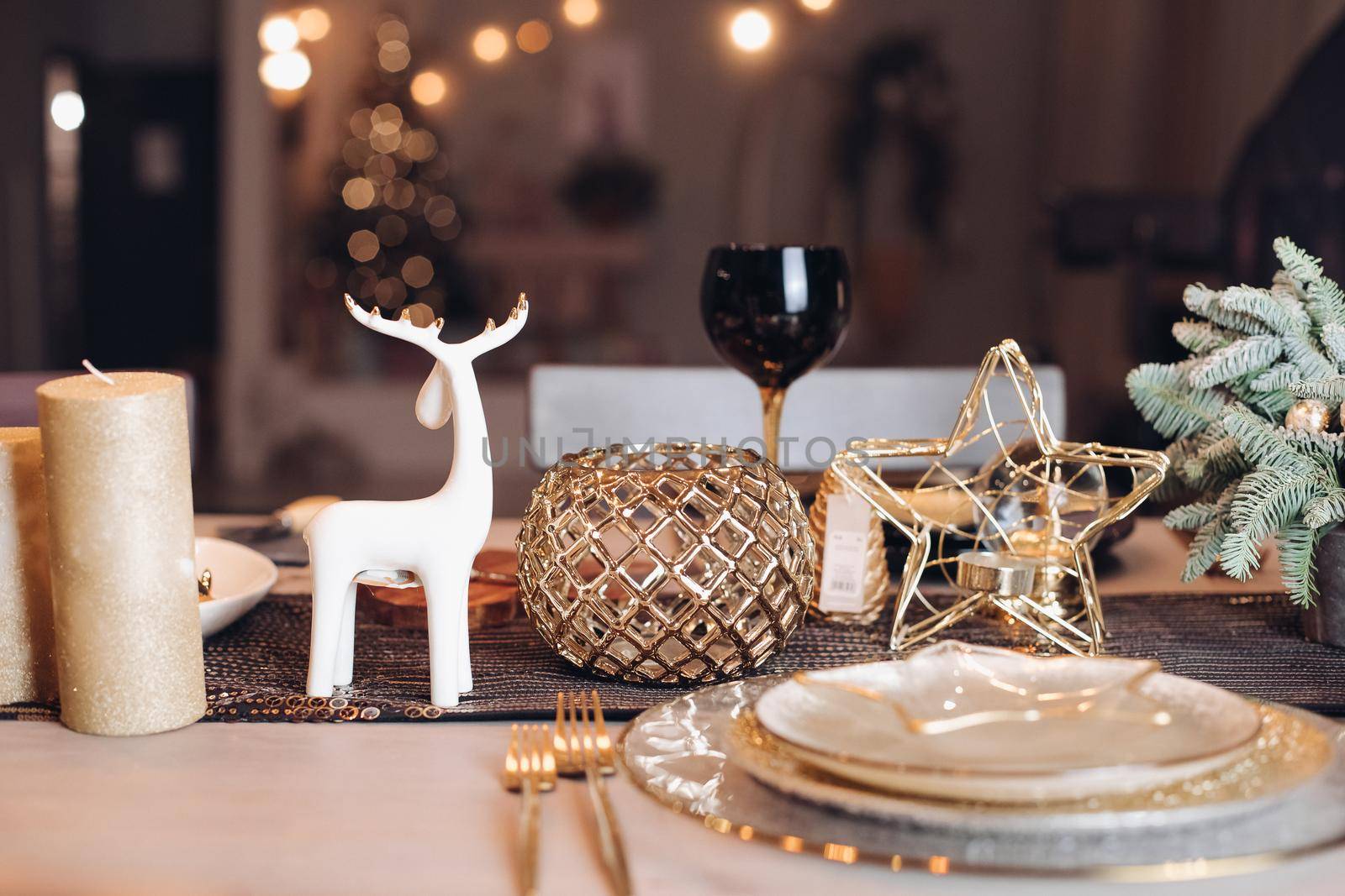 Christmas table in the living room with the objects of holiday decor. New Year eve concept