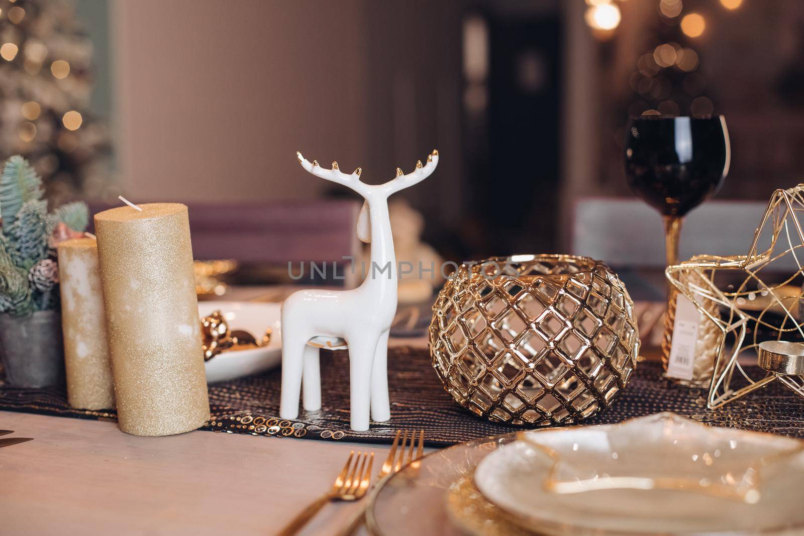 Beautiful table is setting for Christmas dinner by StudioLucky