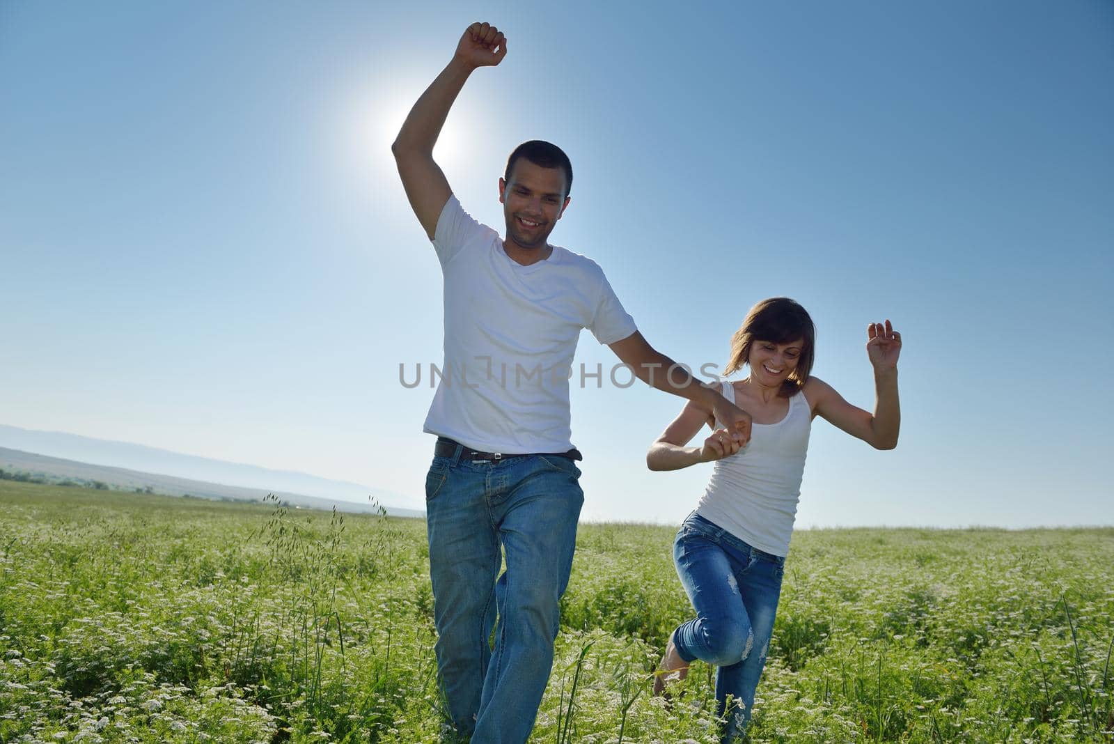 happy young couple in love have romance and fun at wheat field in summer