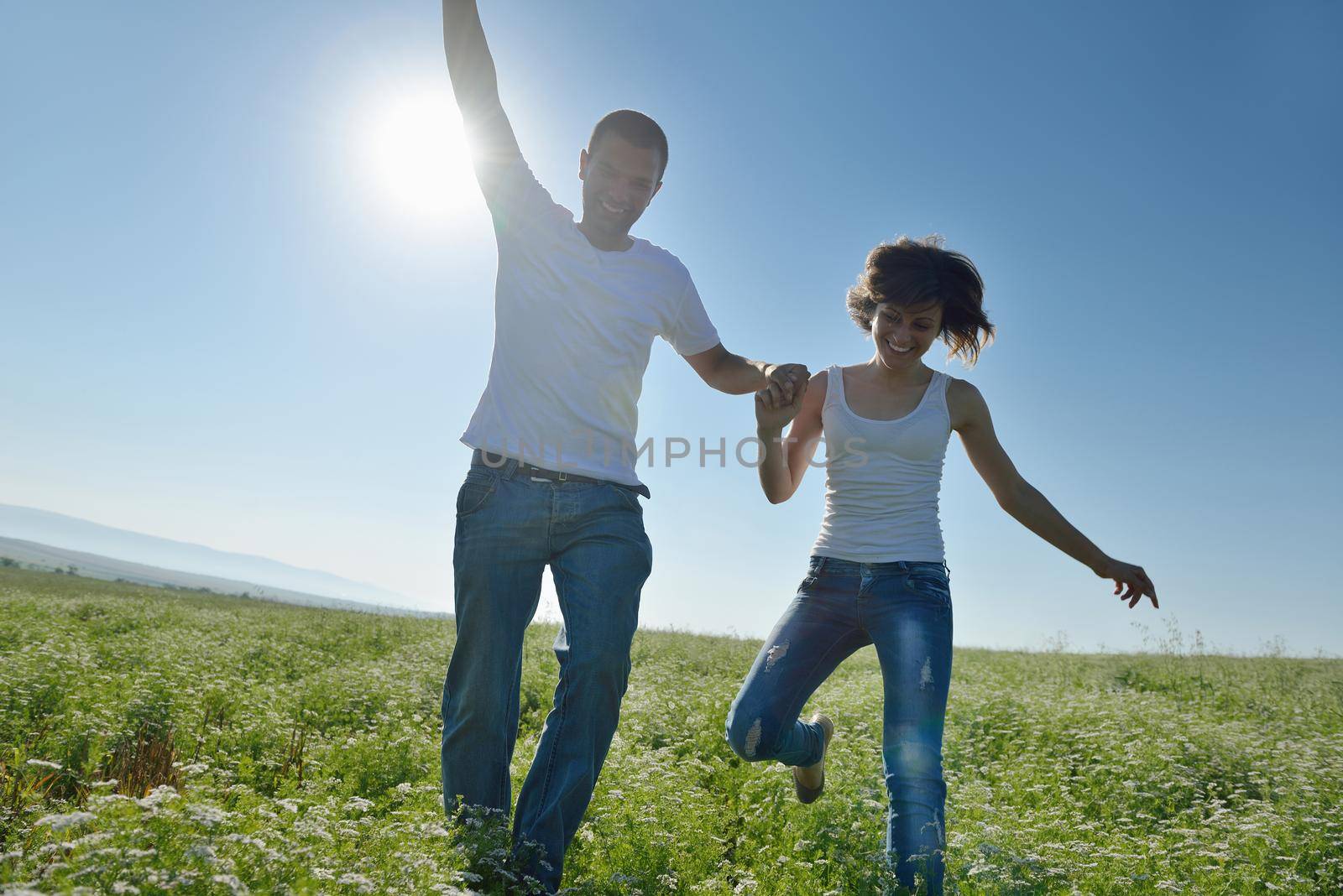 happy young couple in love have romance and fun at wheat field in summer