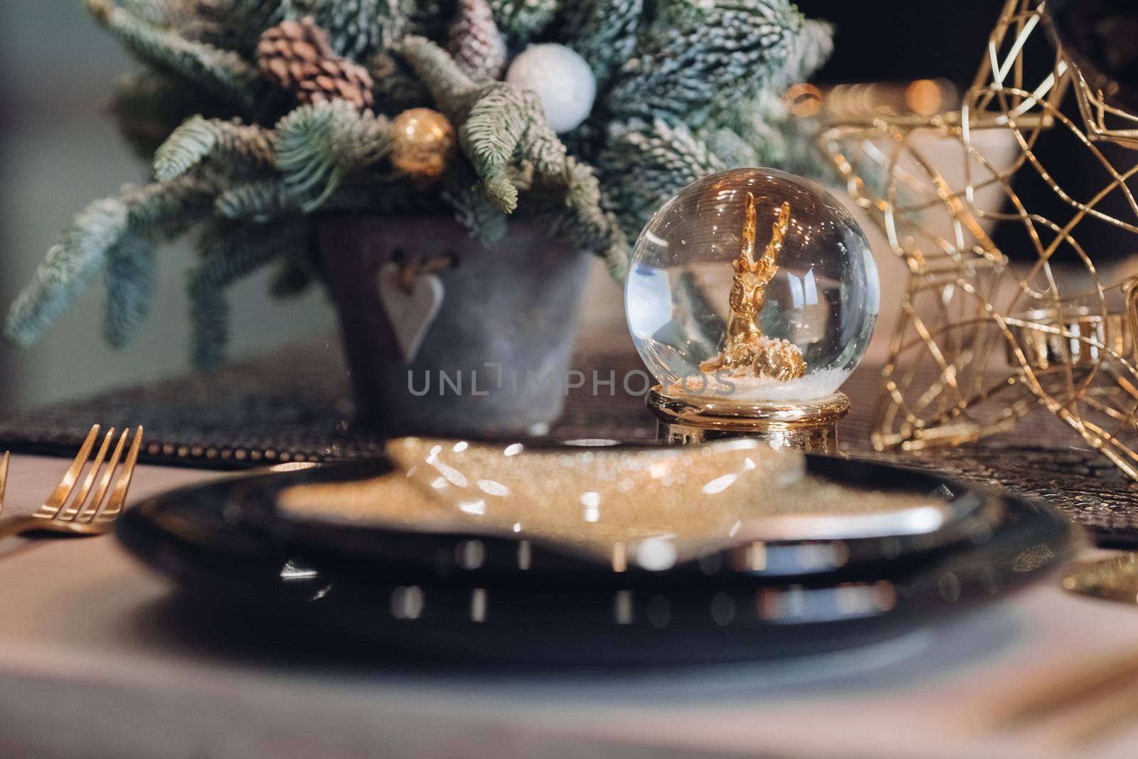 Close up of Christmas holiday table with winter decor by StudioLucky