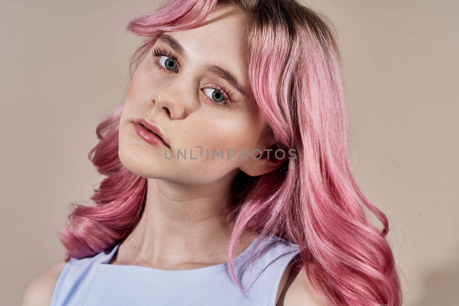 pretty cheerful woman with pink hair bright makeup posing. High quality photo