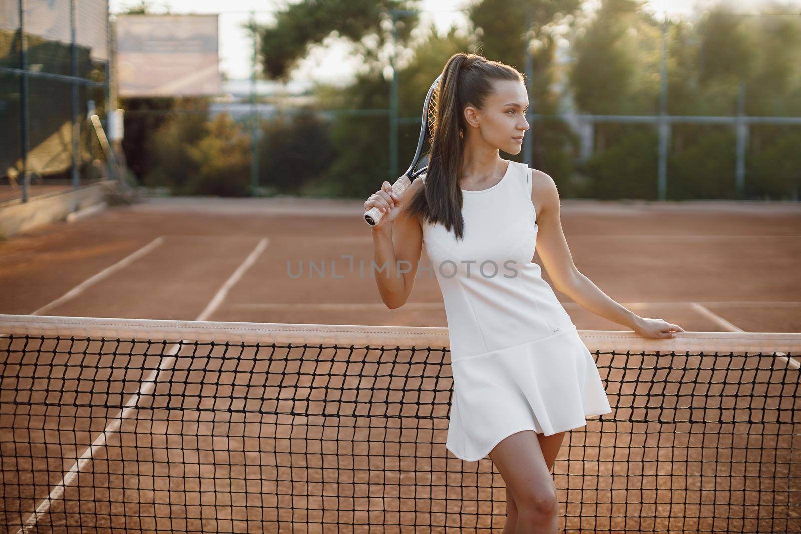 Young beautiful woman tennis player with racket. High quality photo