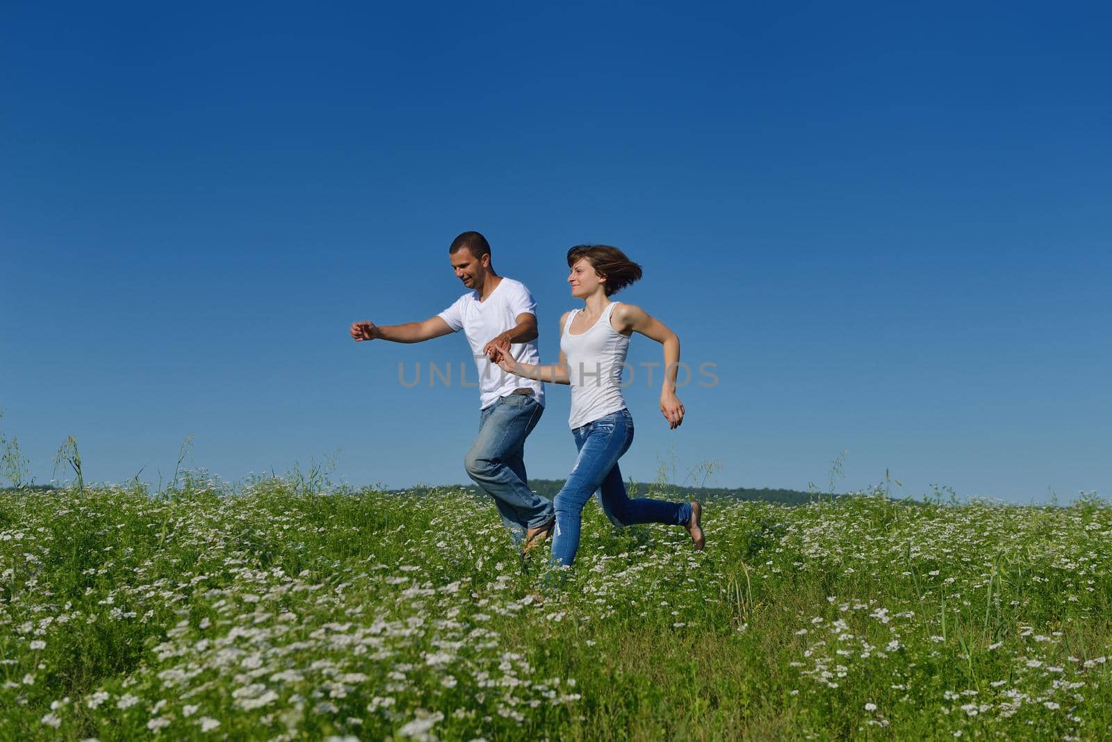 happy young couple in love have romance and fun at wheat field in summer