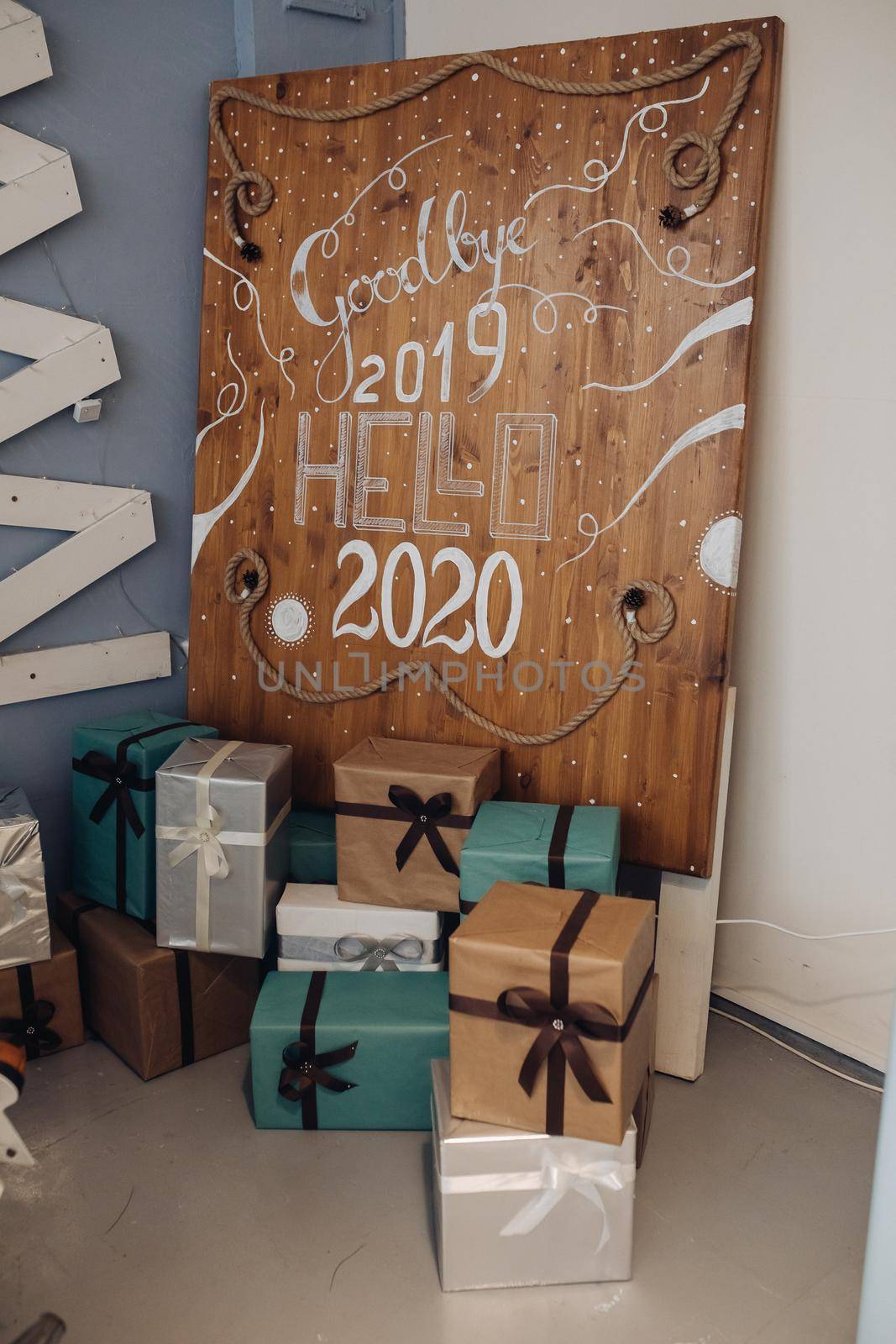 2020 New Year number on wooden background. Christmas holidays by StudioLucky