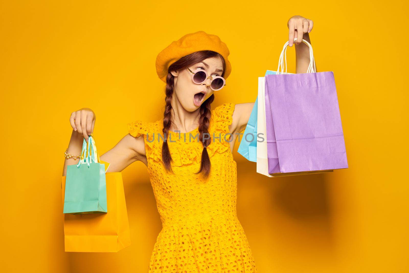 glamorous woman in a yellow hat Shopaholic fashion style isolated background by Vichizh