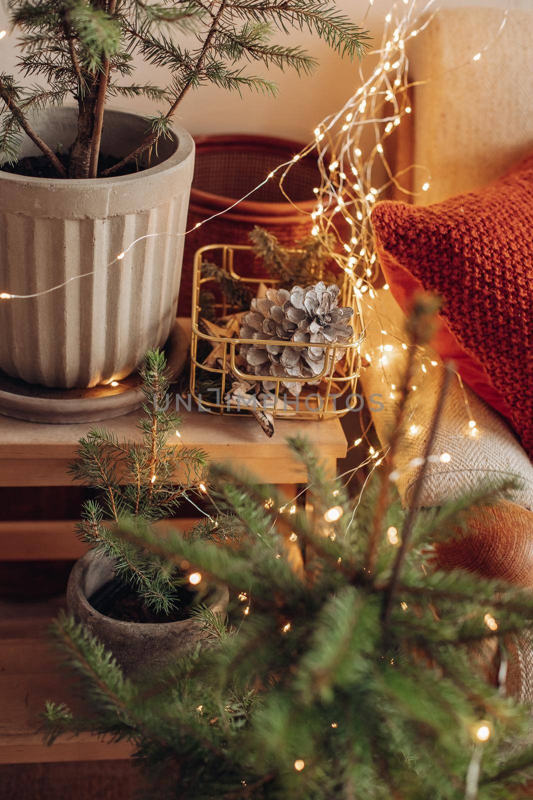 Stock photo of beautiful decorated Christmas tree with blue and silver and white balls and wrapped Christmas presents under the tree. Two Santa Claus figures under tree.