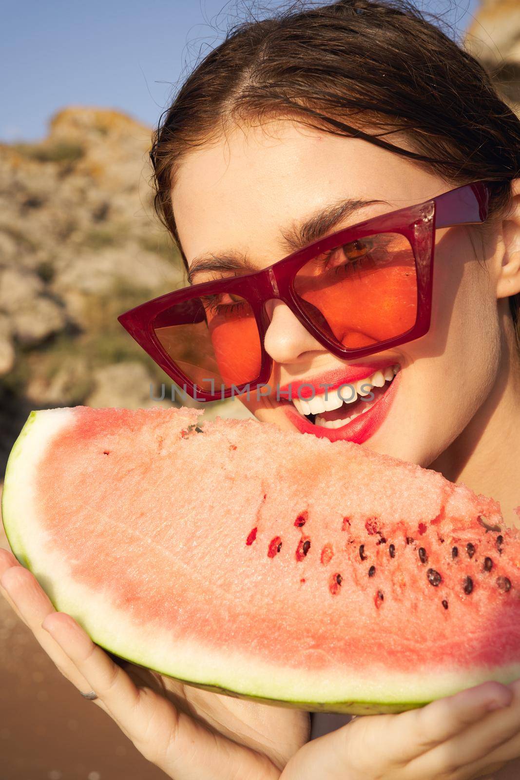 woman eating watermelon outdoors Sun summer close-up. High quality photo