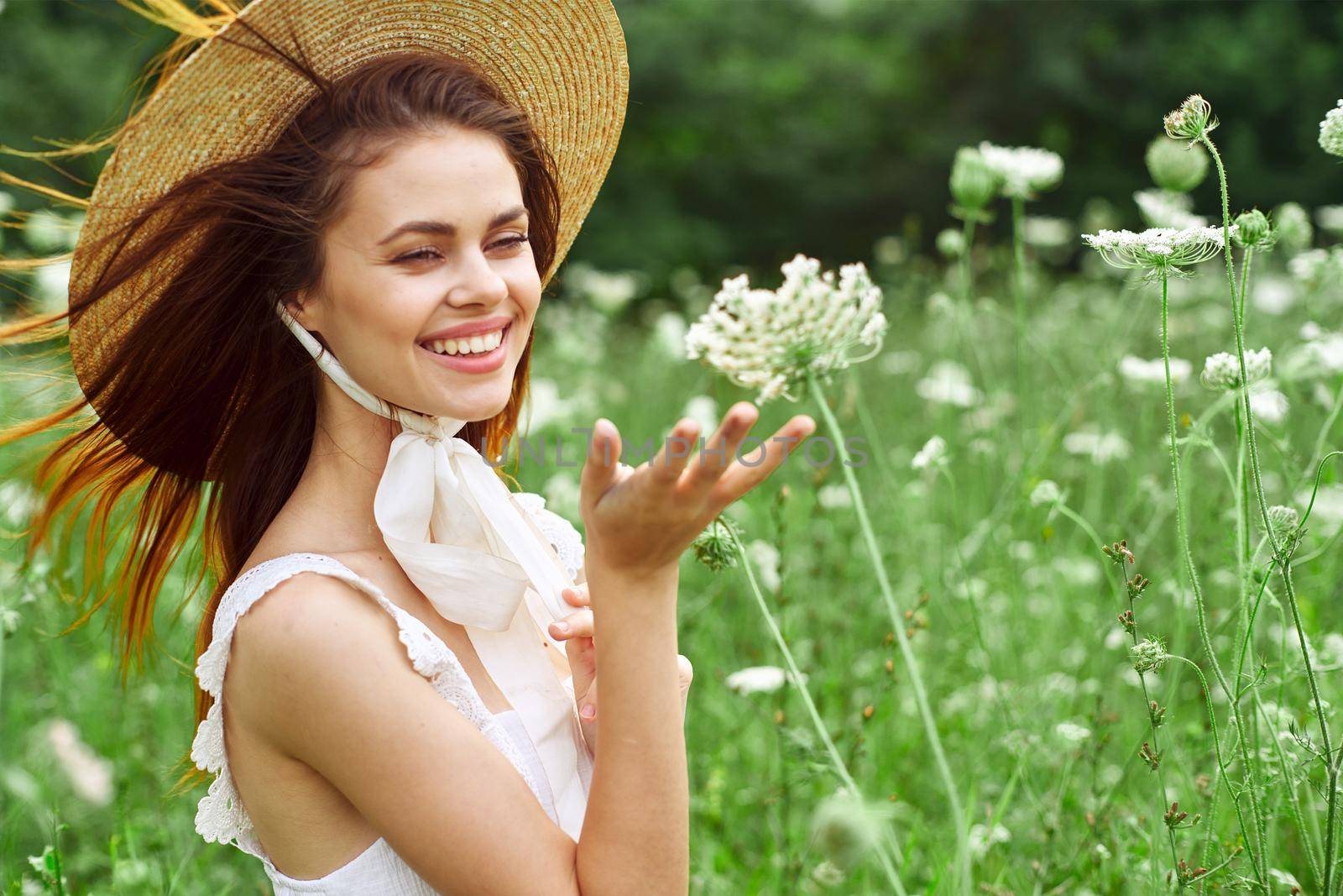 Woman in white dress and hat on nature flowers freedom by Vichizh