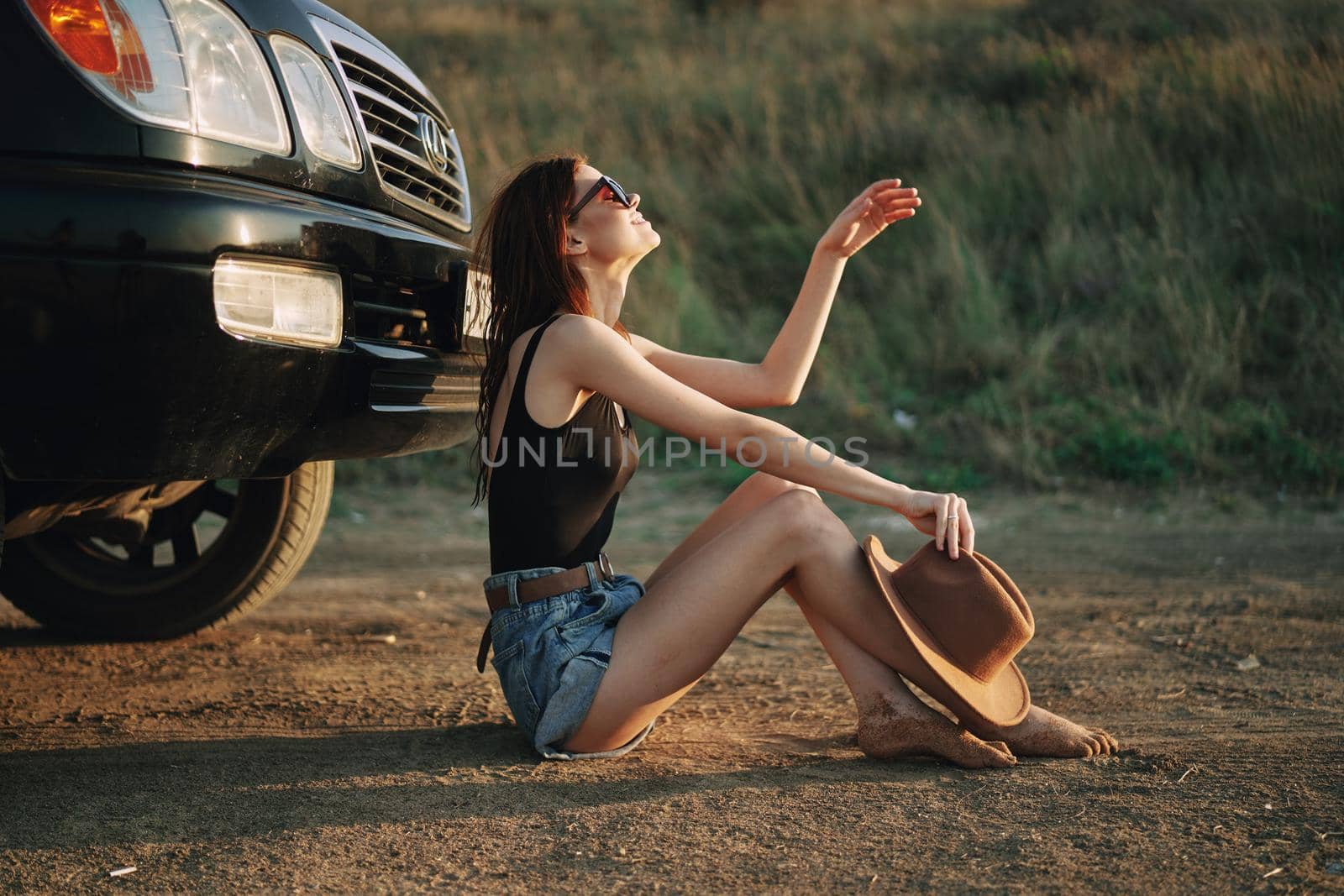 woman in sunglasses near car travel summer vacation landscape by Vichizh