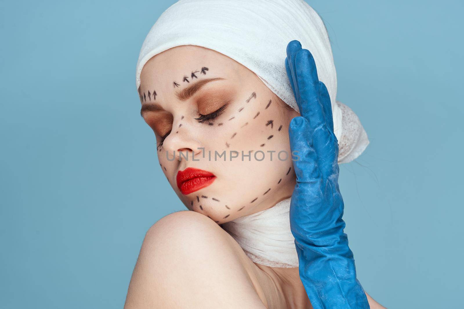 a person in blue gloves syringe in hands contour on the face lifting studio lifestyle. High quality photo