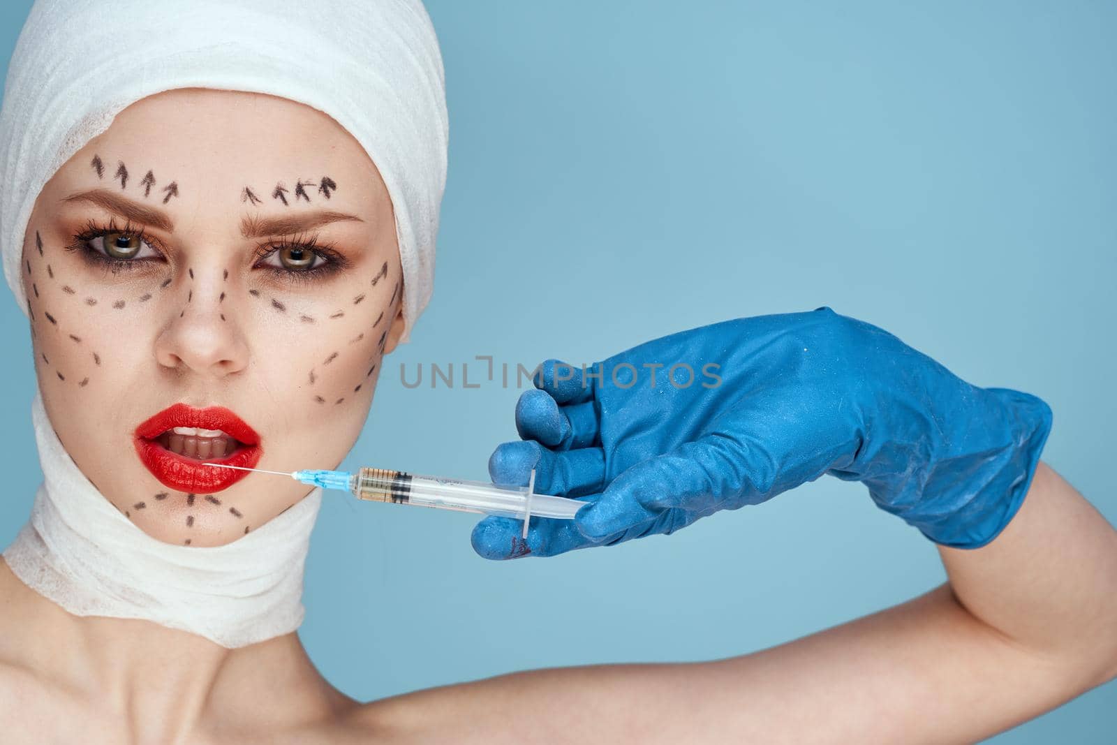 woman posing in blue gloves red lips surgery facial rejuvenation studio lifestyle by Vichizh