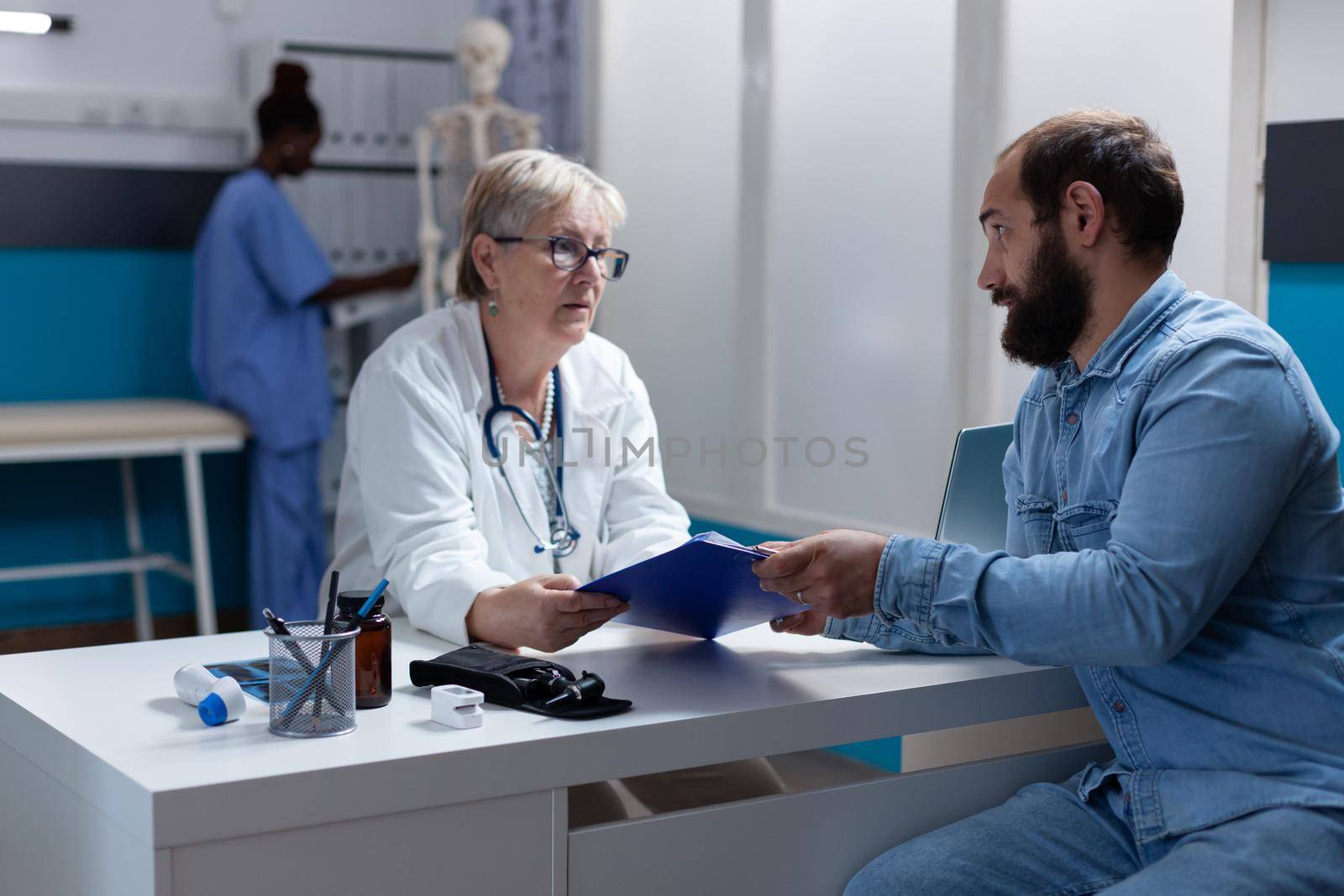 Woman doctor giving clipboard to patient to sign for treatment consent. Physician asking man for signature on checkup papers at medical visit to cure disease. Person signing examination files.