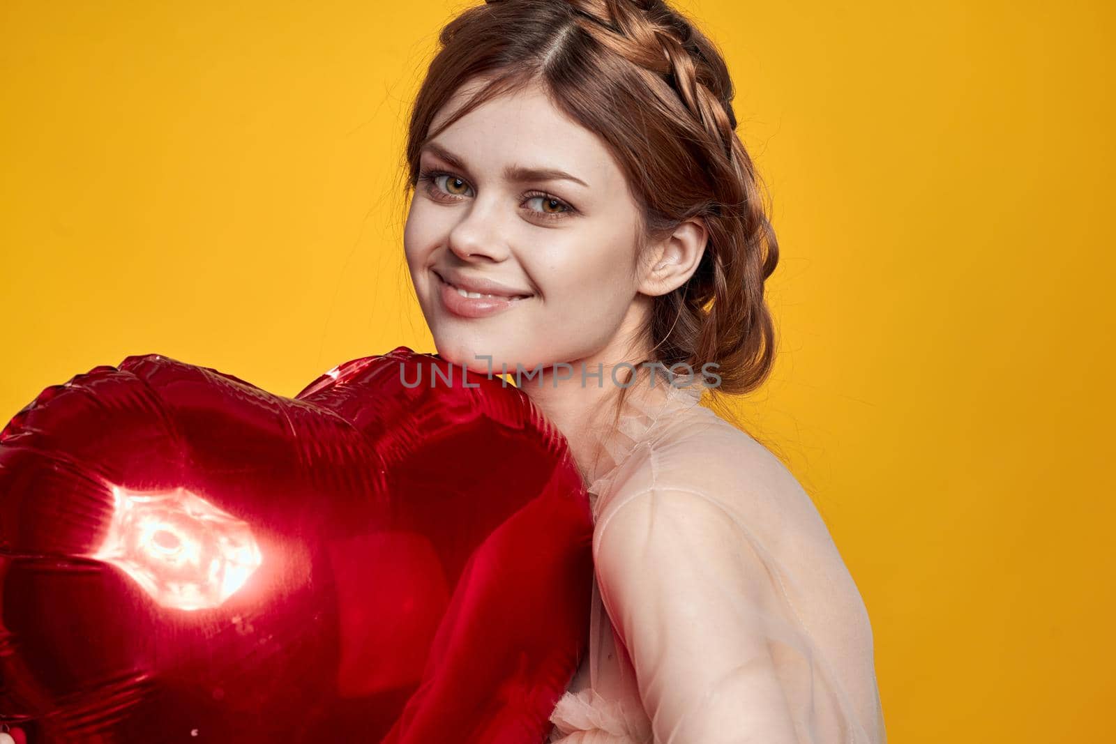 portrait of a woman red heart in the hands of the balloon isolated background by Vichizh