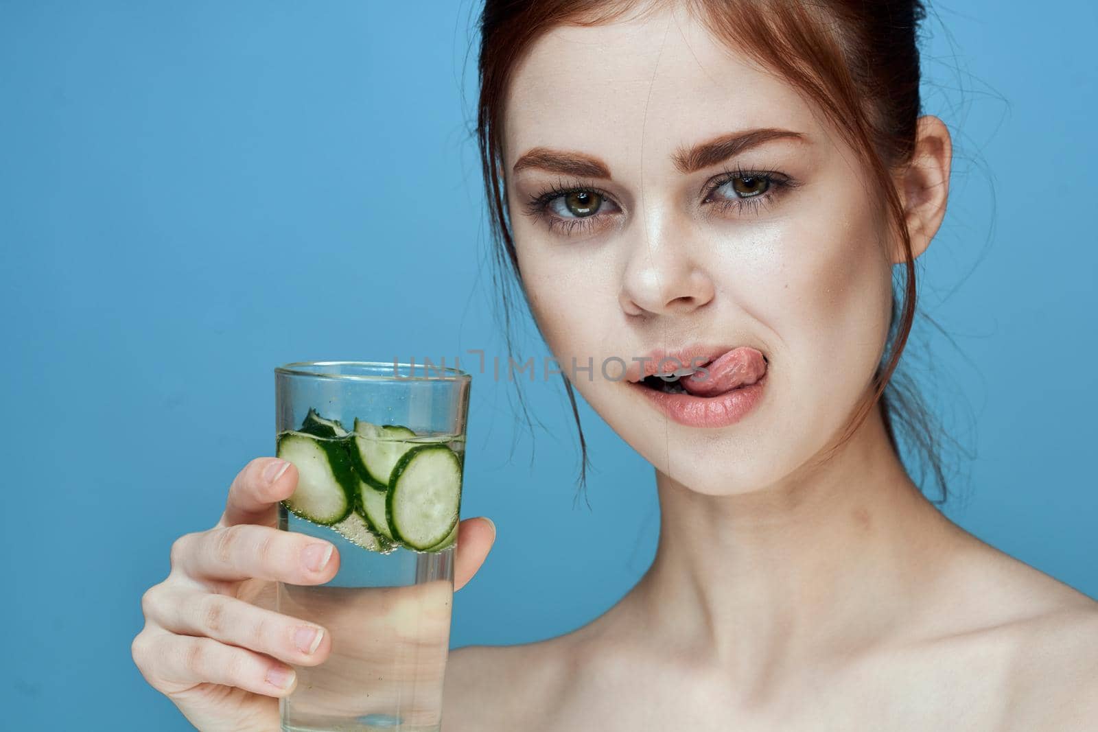 pretty woman with cucumber drink health vitamins by Vichizh