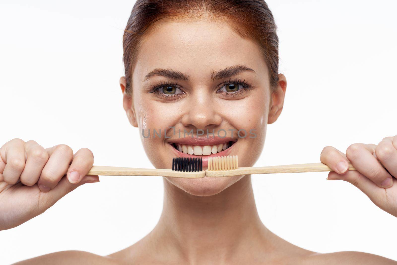 cheerful woman with bare shoulders toothbrushes hygiene oral care by Vichizh